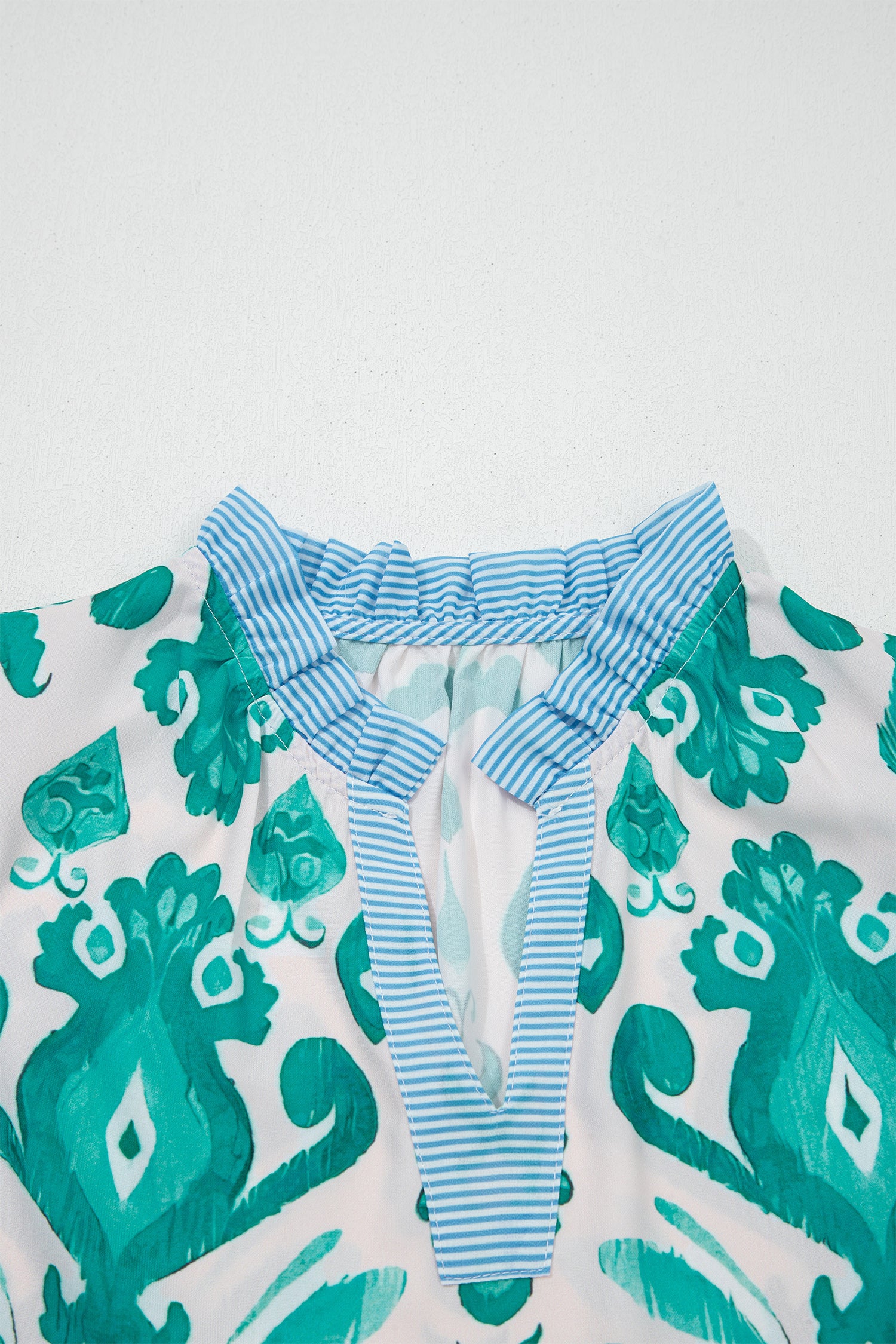 Sky blue ethnic print striped trim flutter sleeve top from Lavendar Lane Clothing, featuring a casual and stylish design.