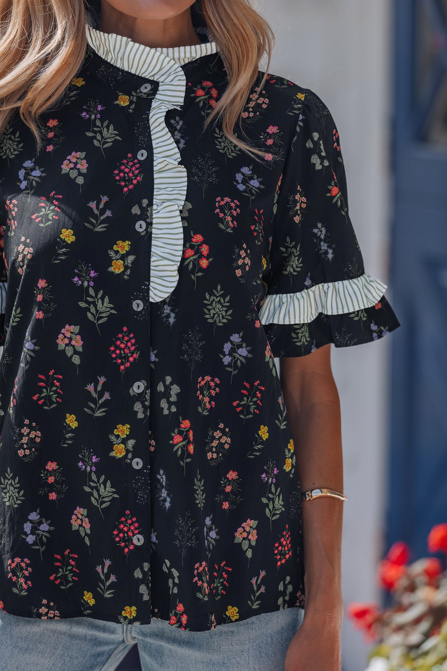 Black floral short sleeve blouse with frilled trim from Lavendar Lane Clothing, showcasing a stylish contrast design.
