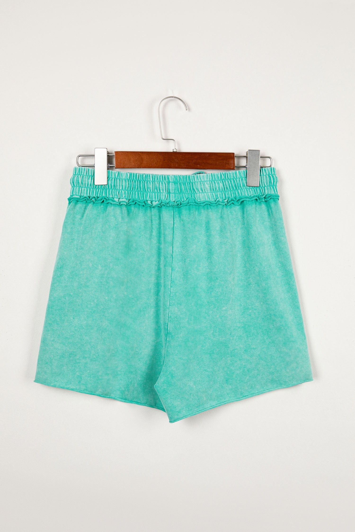 Sea green mineral washed drawstring casual shorts with elastic waist and raw cut hem from Lavendar Lane Clothing