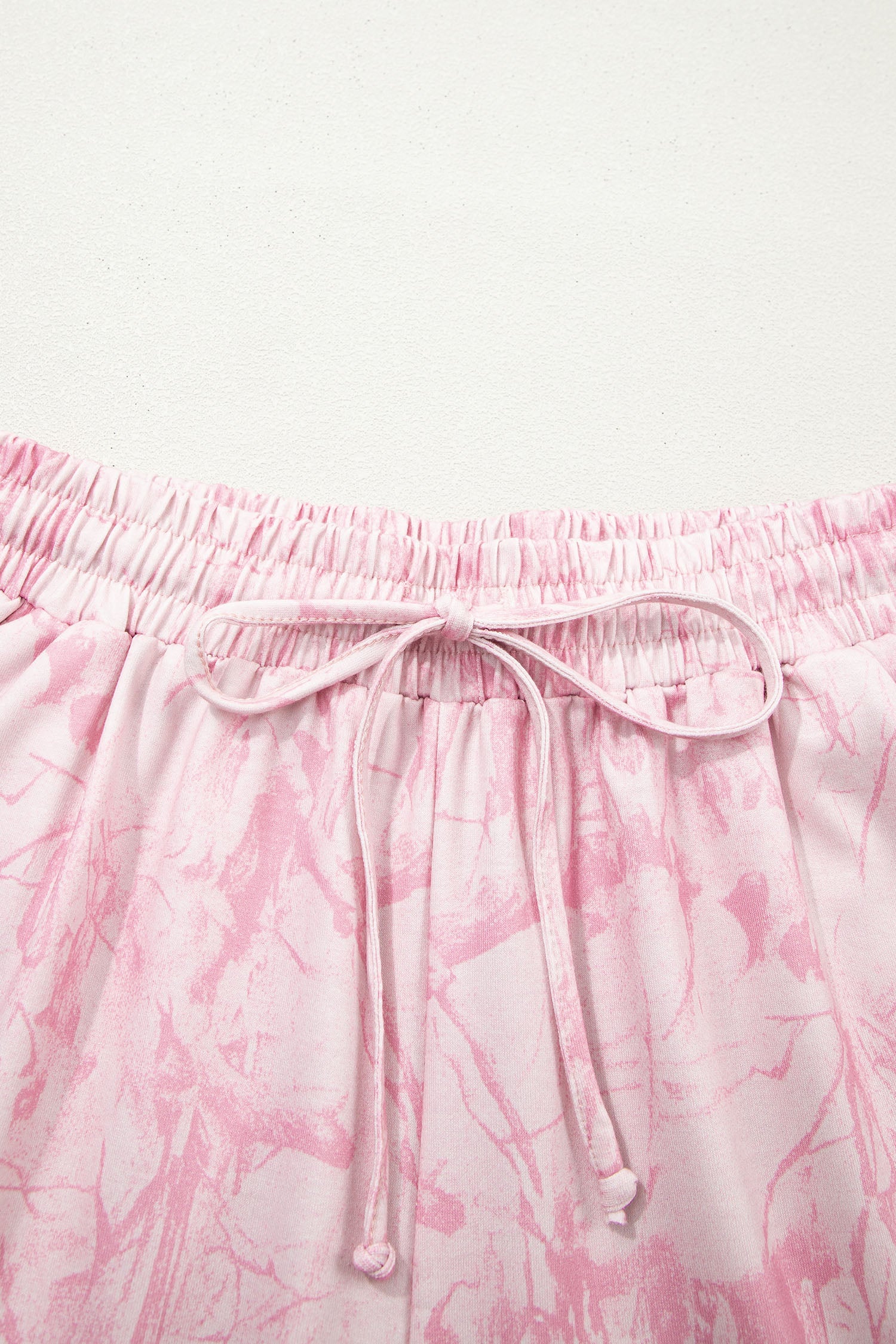 Pink abstract print V-neck loose tee and drawstring shorts two-piece set by Lavendar Lane Clothing, casual summer outfit.