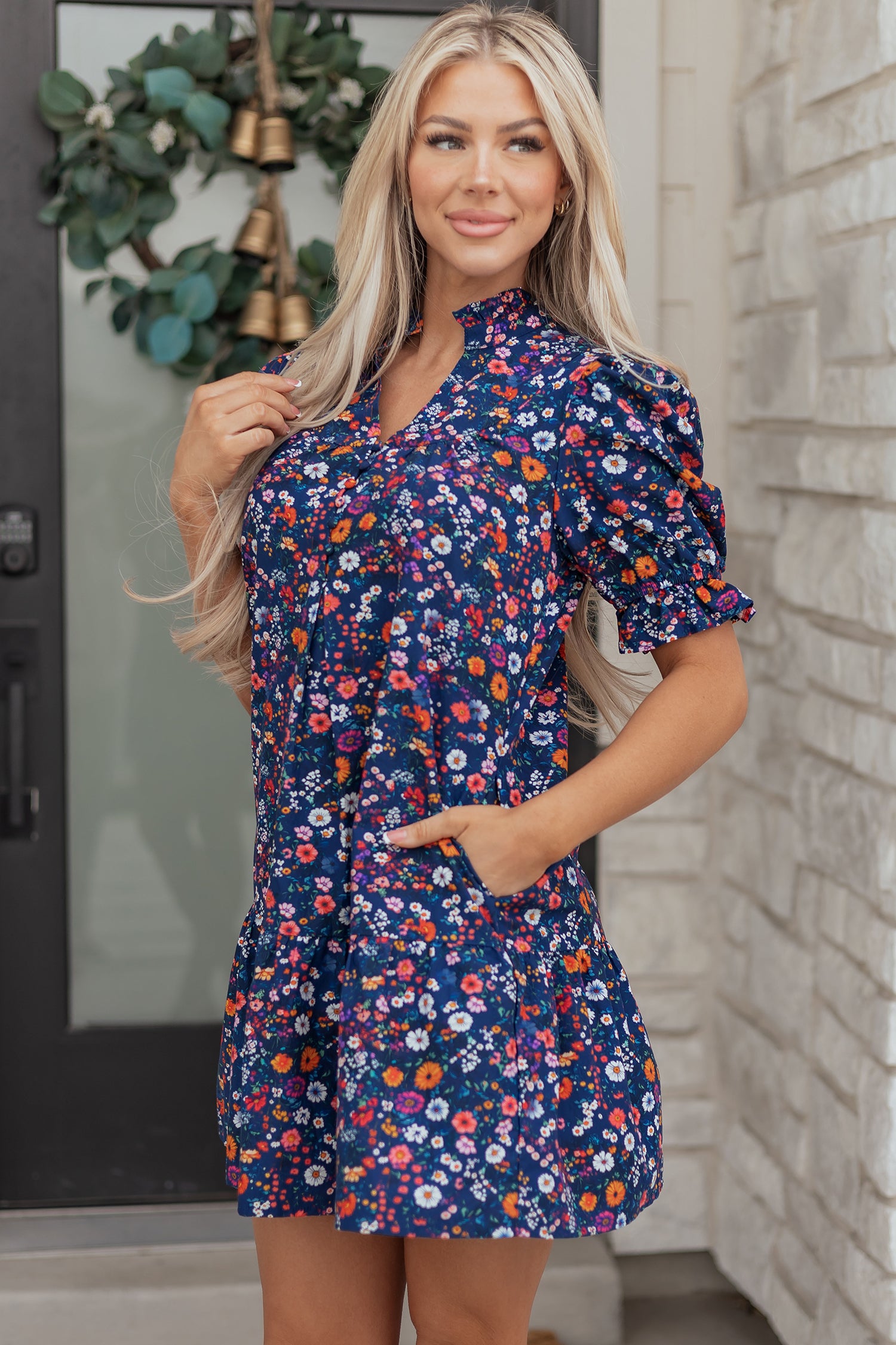 Blue Wild Daisy Floral Split Neck Short Puff Sleeve Mini Dress by Lavendar Lane Clothing, featuring a floral pattern and feminine style.