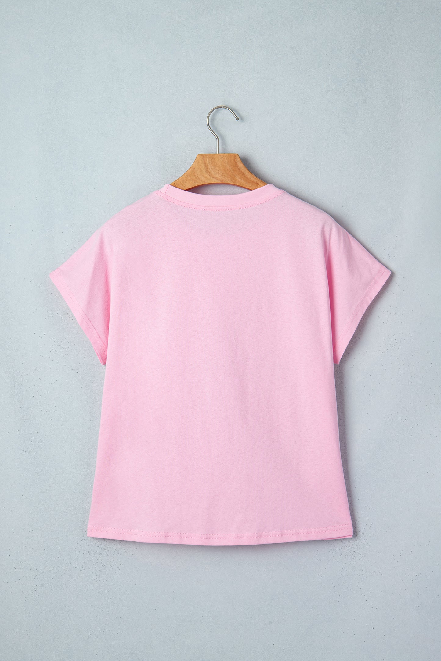 Pink leopard bow embroidered cotton round neck T-shirt by Lavender Lane Clothing, featuring a playful animal print and bow detail.