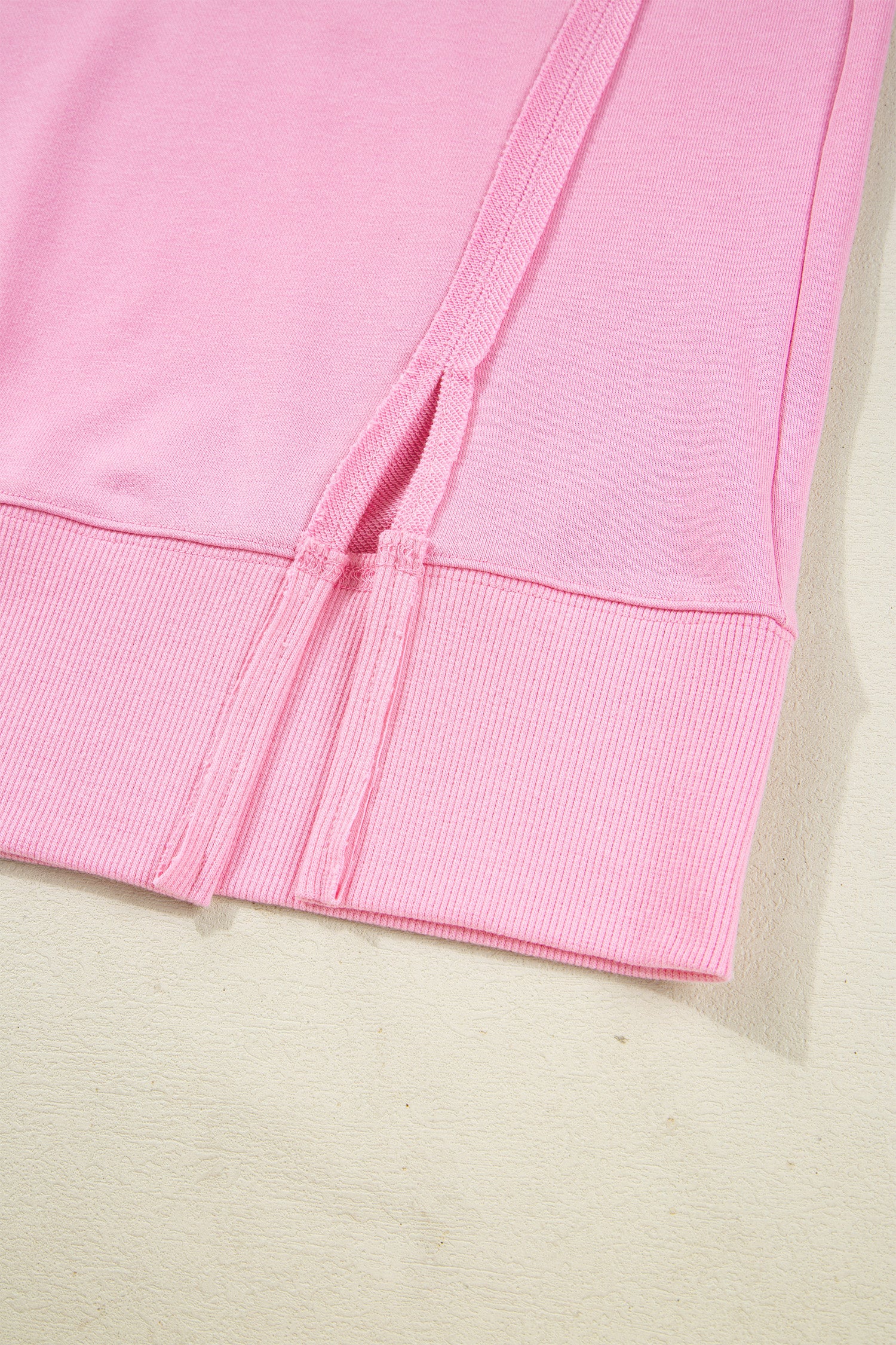Pink sequin XOXO graphic sweatshirt with bow accents, baggy fit, exposed seams, from Lavendar Lane Clothing.
