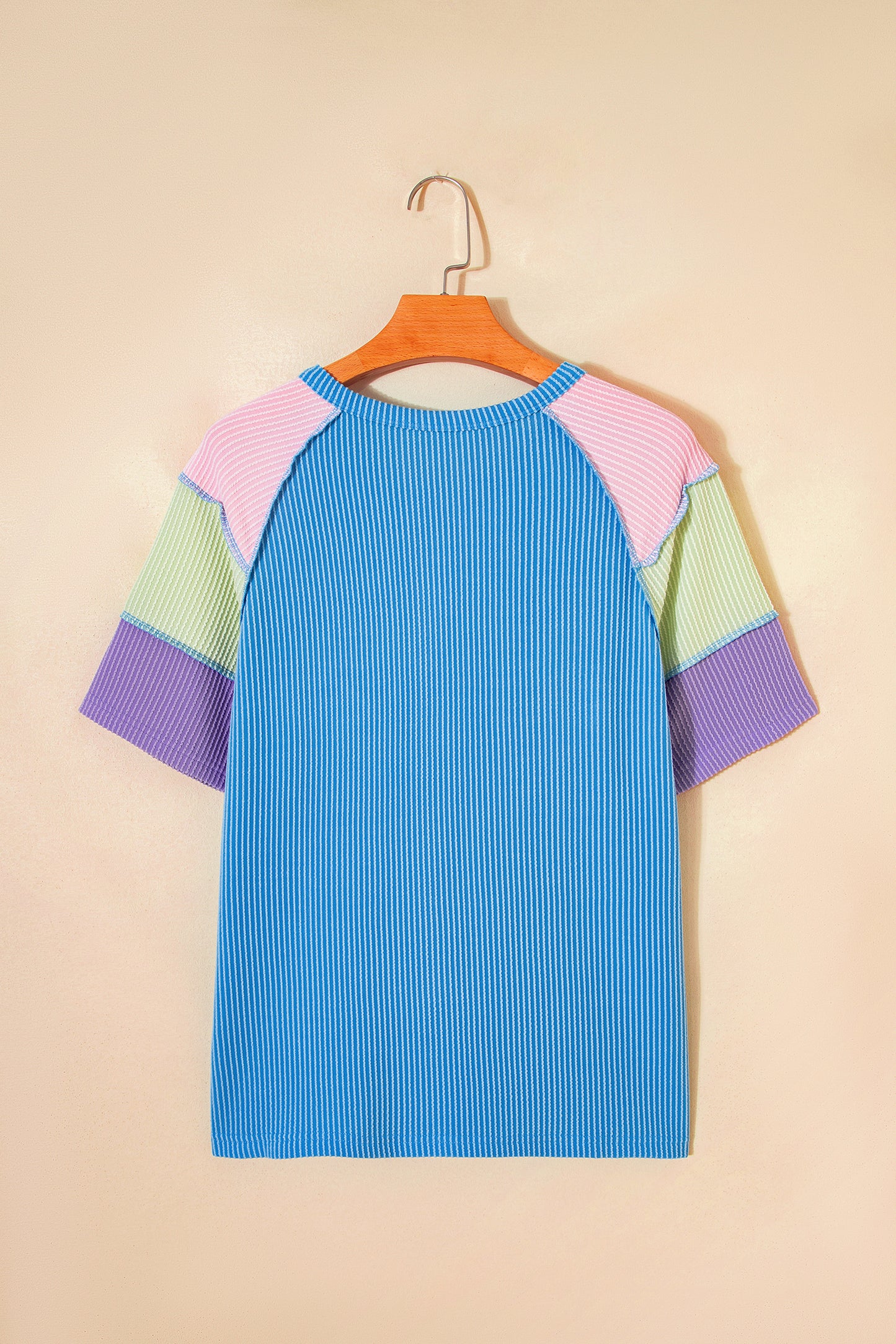Blue twisted ribbed color block patchwork Henley blouse by Lavendar Lane Clothing, featuring short sleeves and a stylish design.