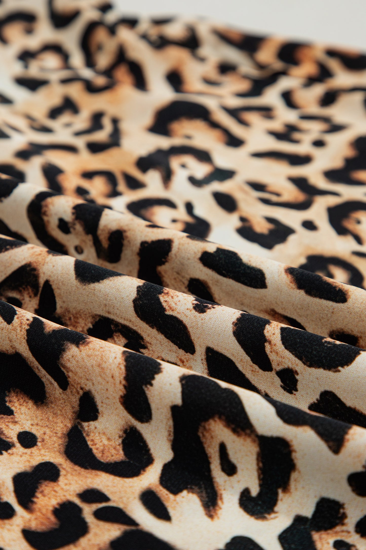 Plus size khaki leopard print blouse with ruffles and stitch detail, short sleeves, by Lavender Lane Clothing.