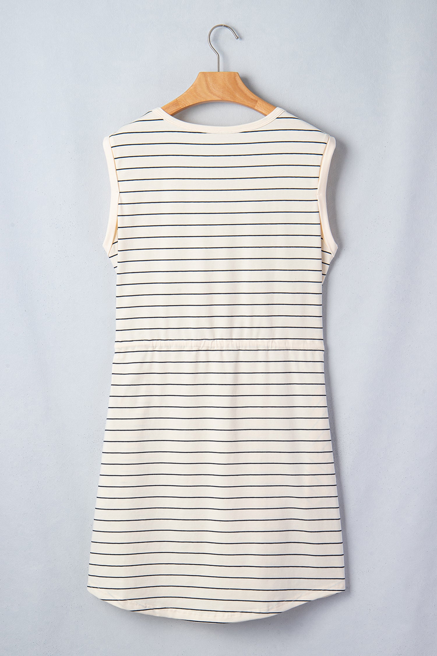 Beige striped drawstring tunic mini dress with pockets from Lavender Lane Clothing, featuring a relaxed fit and casual style.