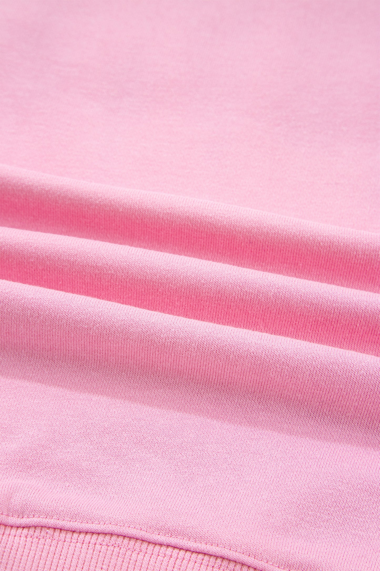 Pink sequin XOXO letter graphic baggy sweatshirt with exposed seams from Lavendar Lane Clothing, casual blouse style.