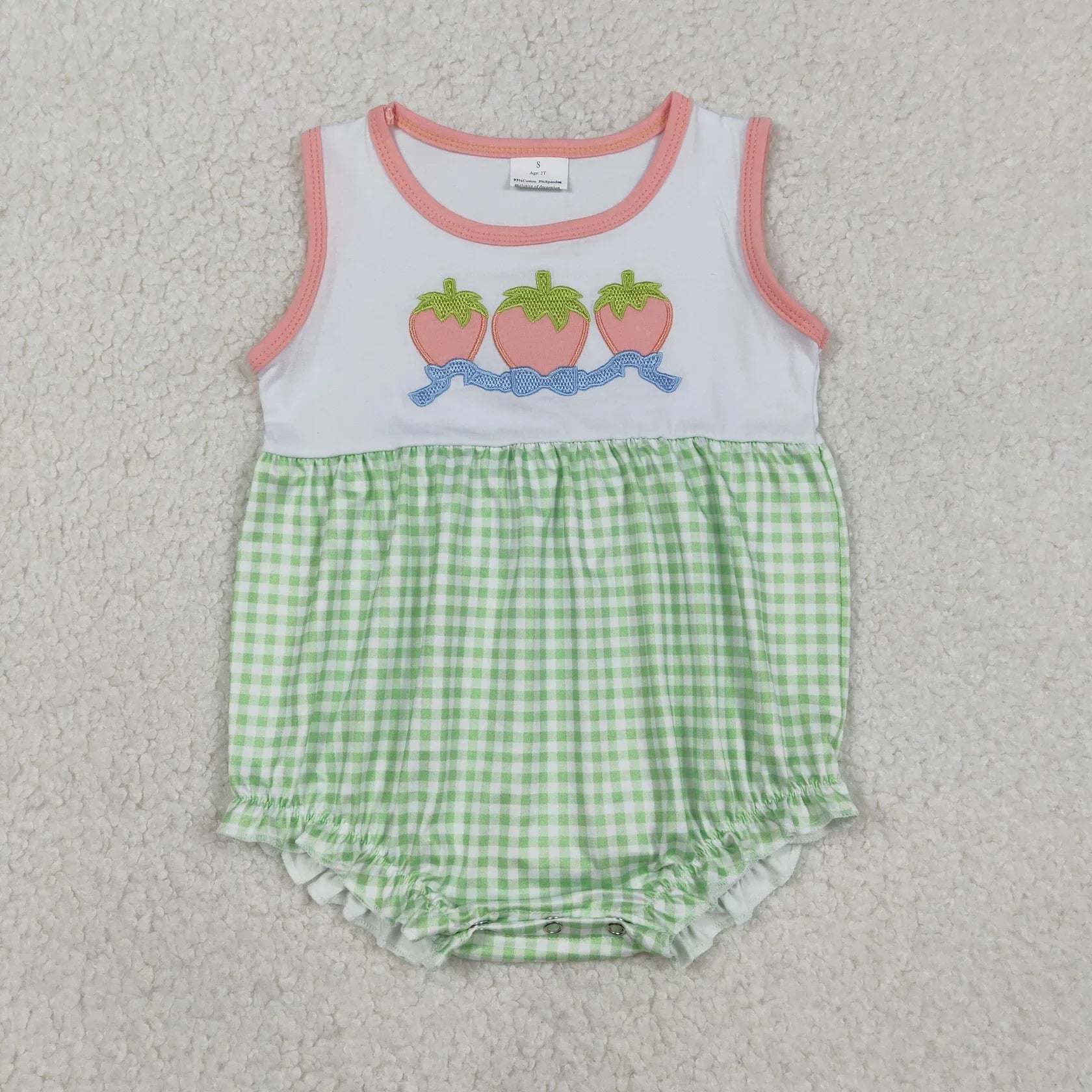 Girl's camo print romper by Lavendar Lane Clothing, featuring embroidery, bows, and ruffles for a stylish look.