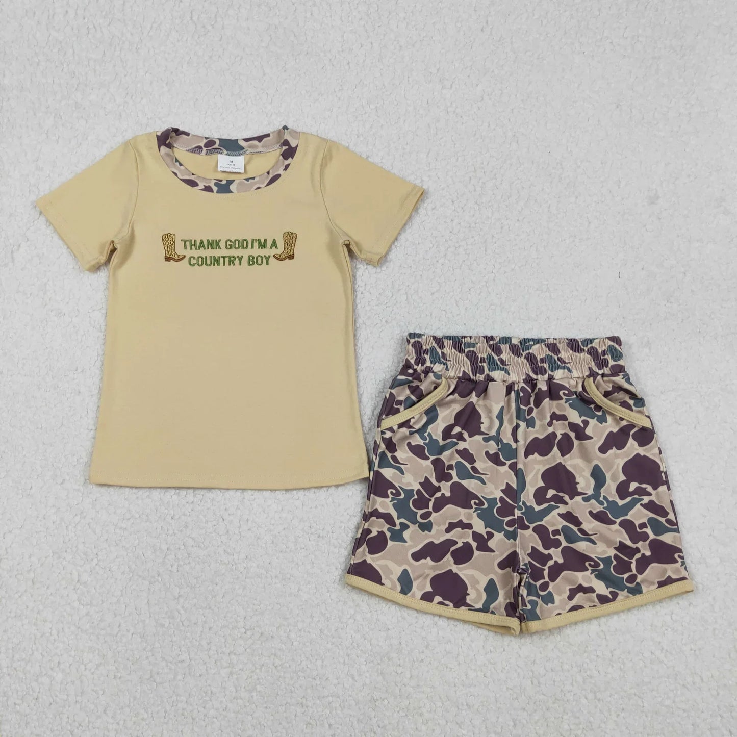 Boy's short sleeve shorts set from Lavendar Lane Clothing in playful colors and patterns, perfect for summer wear.