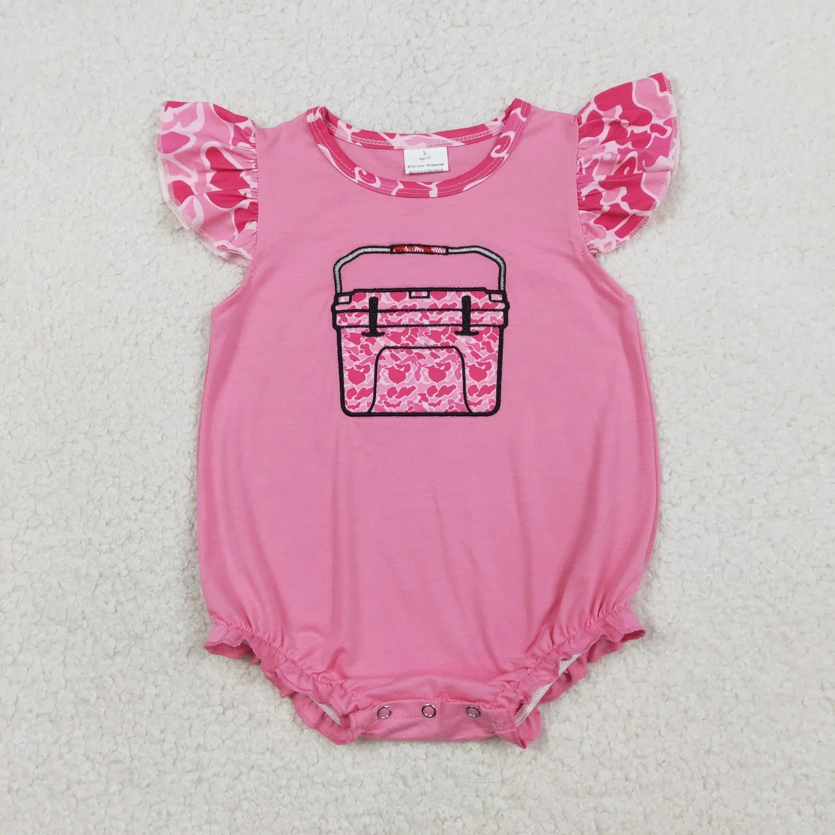 Girl's camo print romper by Lavendar Lane with embroidery, bows, and ruffles, showcasing a stylish design.