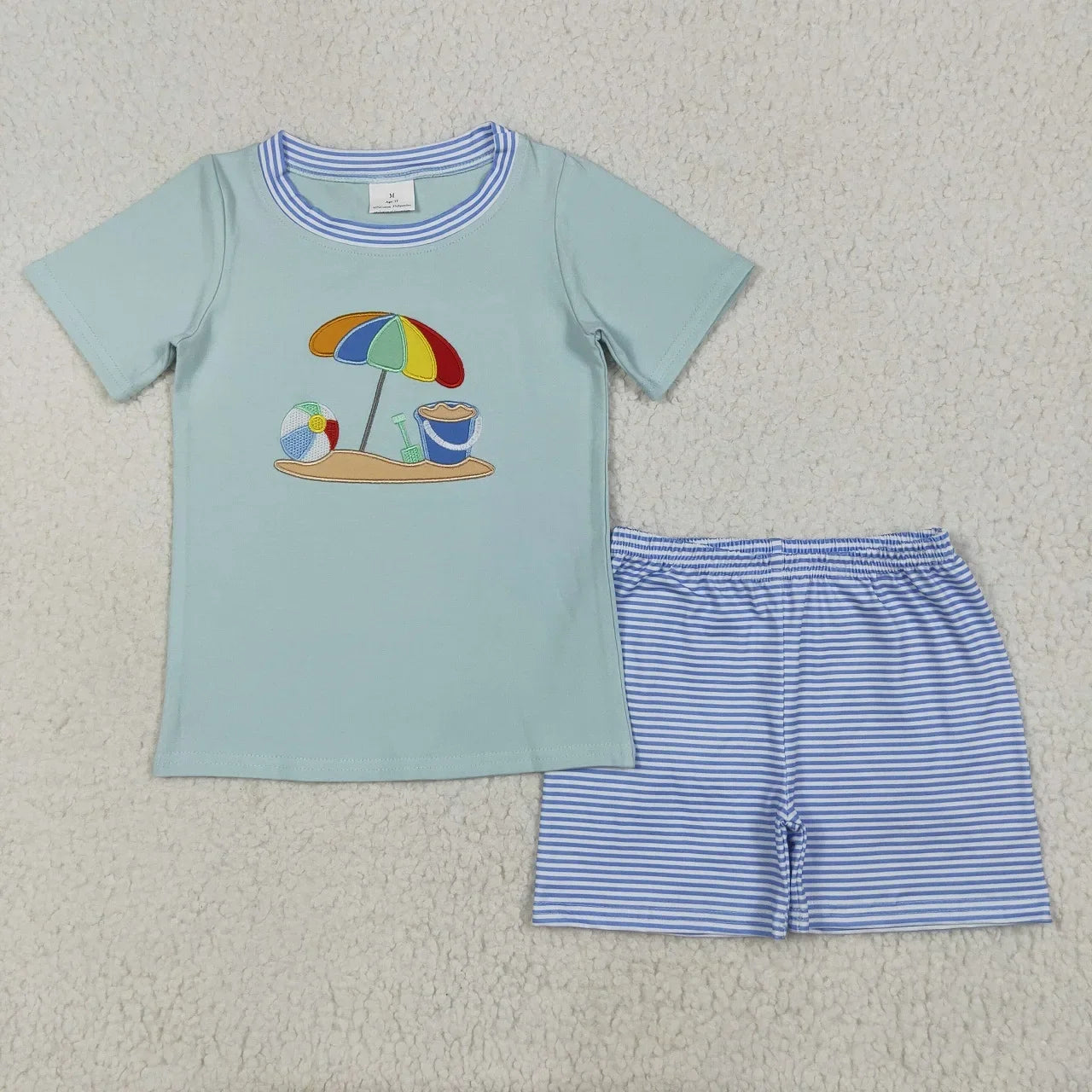 Lavendar Lane Clothing boy's short sleeve shorts set in vibrant colors with playful patterns, perfect for summer wear.