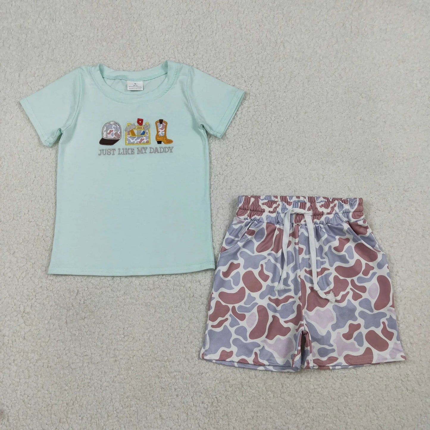 Boy's short sleeve shirt and shorts set from Lavendar Lane Clothing in a vibrant pattern and comfortable fit.