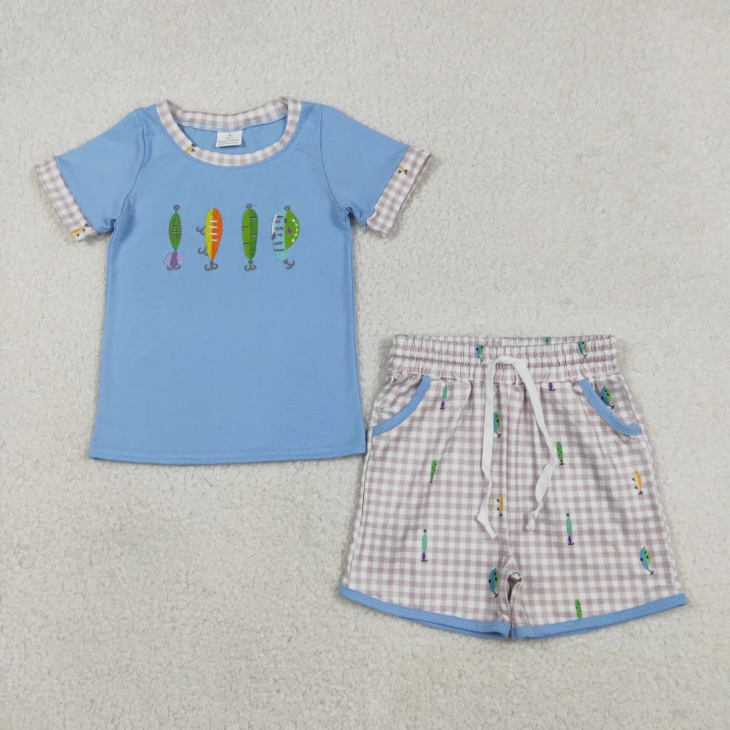Lavendar Lane Clothing boy's short sleeve shirt and shorts set in bright colors, perfect for summer wear.