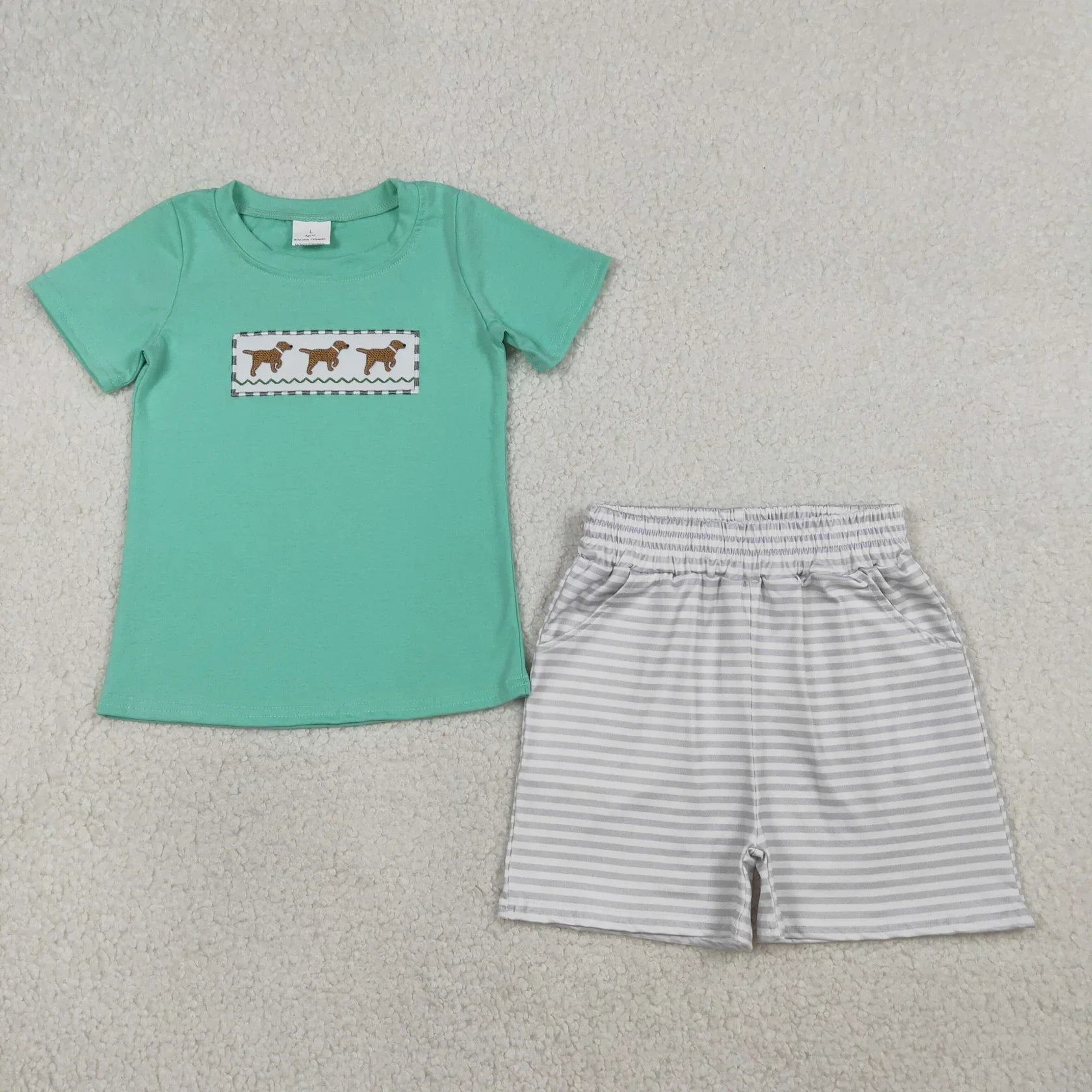 Lavendar Lane Clothing boy's short sleeve shirt and shorts set in a vibrant pattern, perfect for casual summer wear.