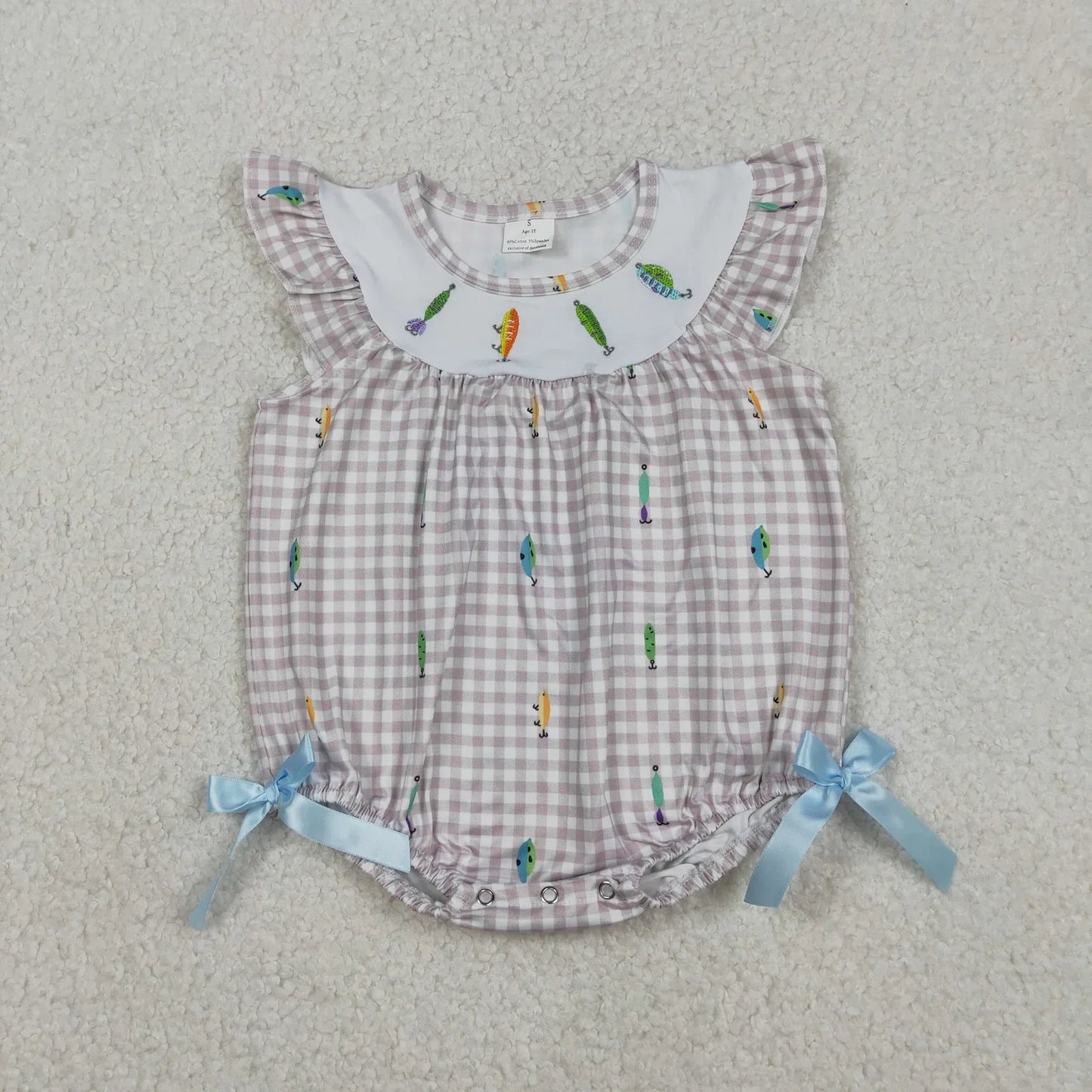 Girl's camo print romper by Lavendar Lane Clothing featuring embroidery, bows, and ruffles for a stylish look.
