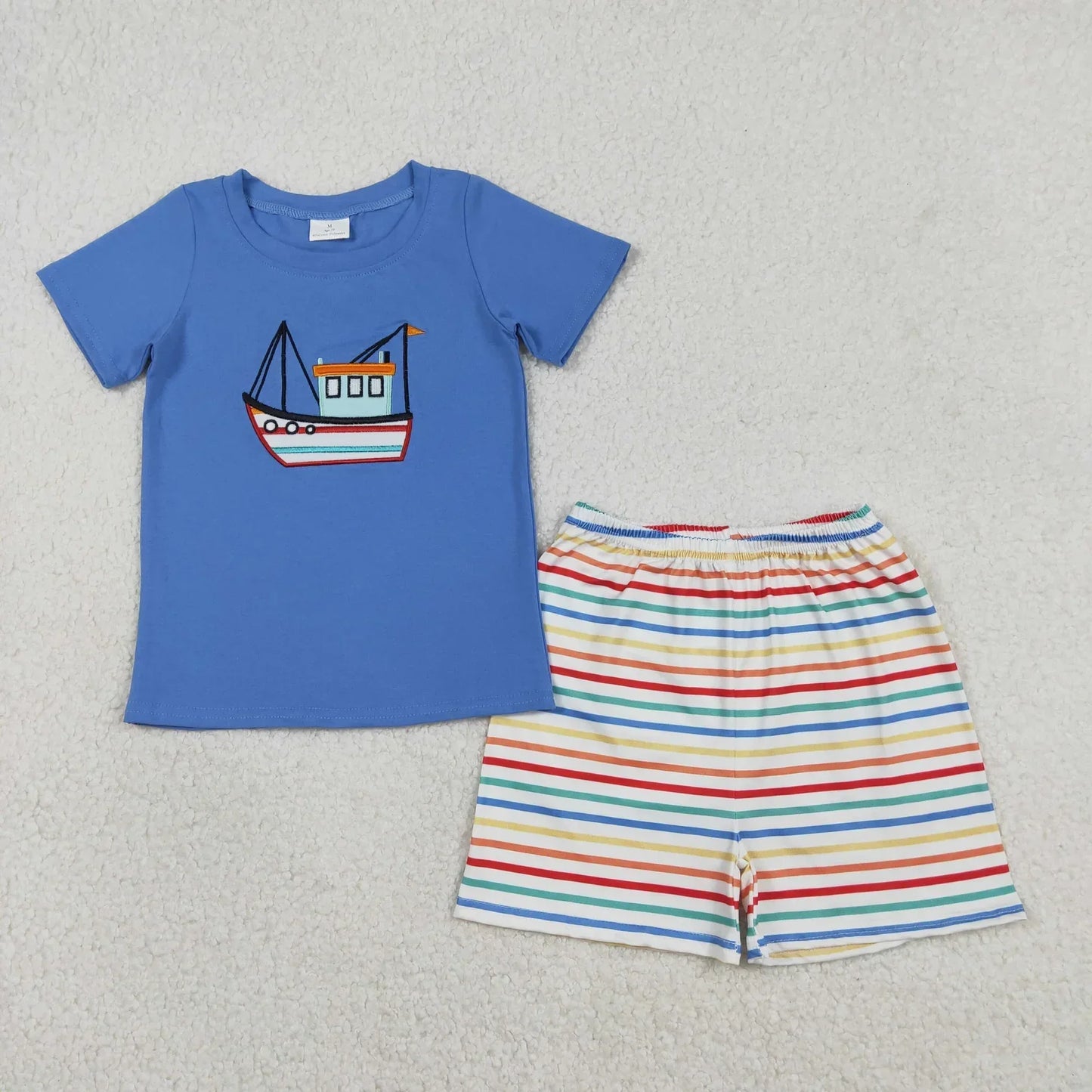 Boy's short sleeve shorts set by Lavendar Lane Clothing in a colorful design with a relaxed fit for summer wear.