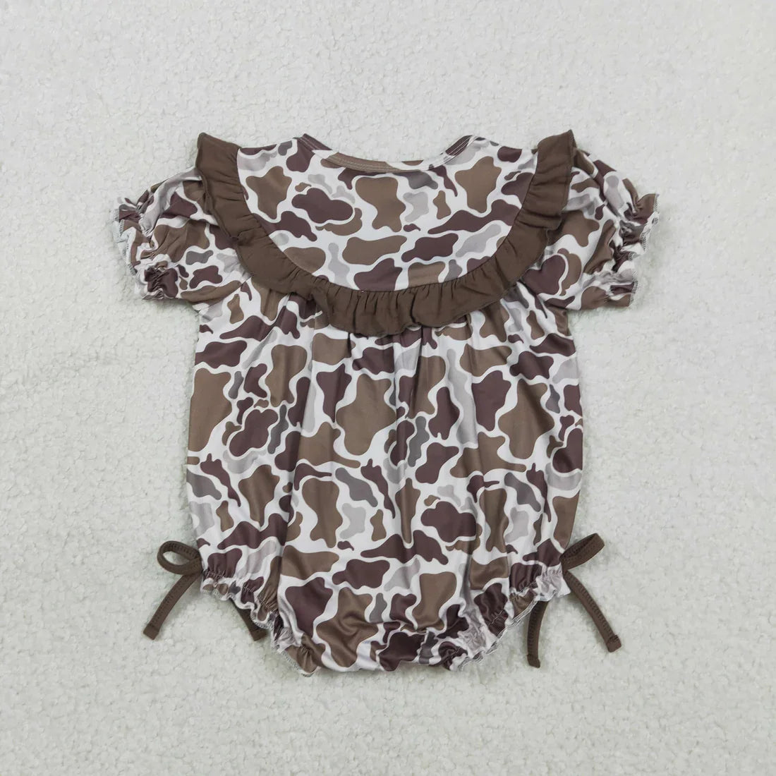 Girl's camo print romper by Lavendar Lane Clothing featuring bows, ruffles, and detailed embroidery design.