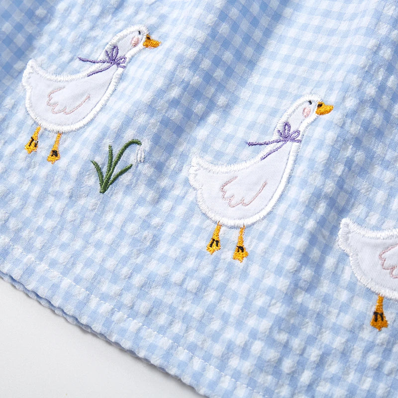 Girl's Lattice Duck Print Cotton Dress by Lavendar Lane Clothing featuring a playful duck pattern and comfortable fit.