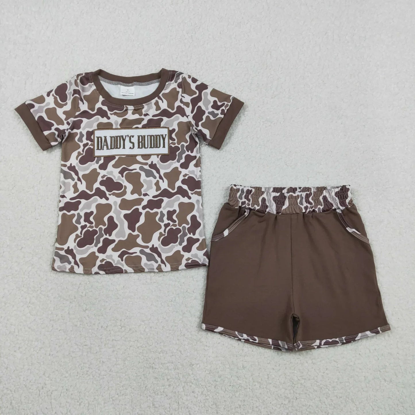 Lavendar Lane Clothing boy's short sleeve shorts set featuring a playful design and vibrant colors for summer wear.