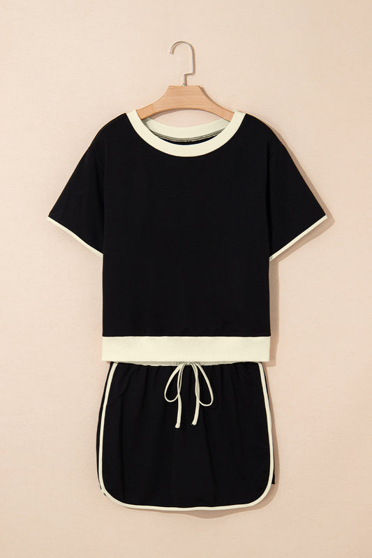 Black colorblock edge drop shoulder top and matching skort two-piece set by Lavendar Lane Clothing, casual and stylish.