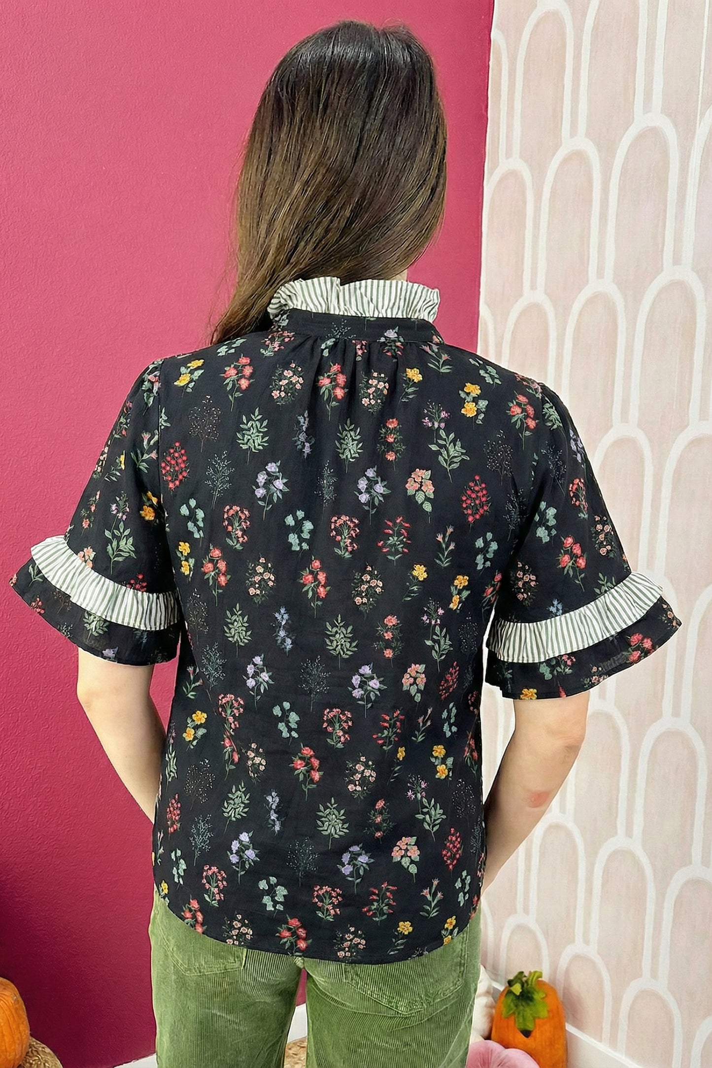 Black floral blouse with contrast frilled trim, short sleeves, from Lavendar Lane Clothing, featuring a stylish and feminine design.