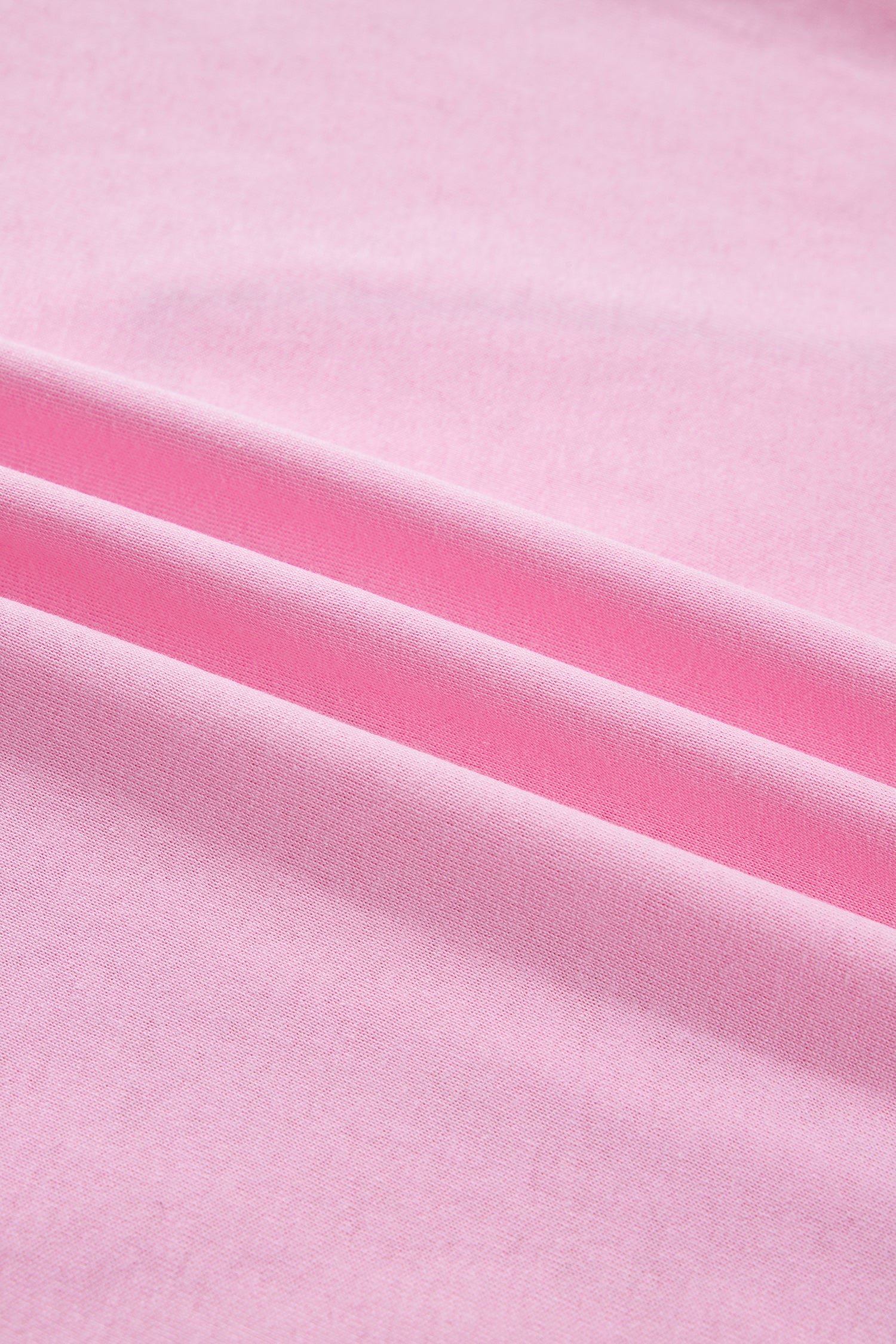 Pink leopard embroidered cotton round neck T-shirt from Lavendar Lane Clothing, featuring a playful bow detail and comfortable fit.