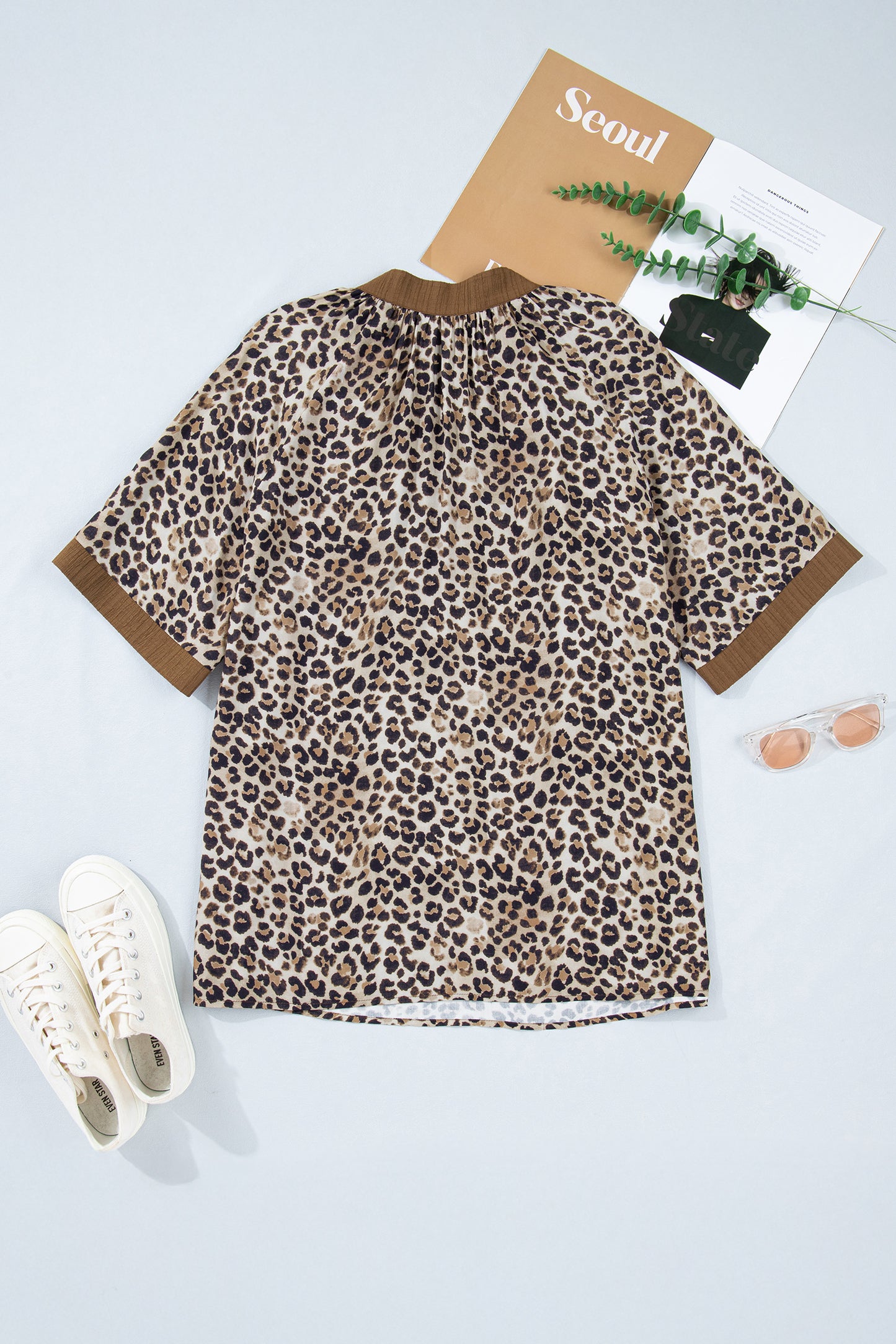 Brown plus size leopard print blouse with crinkled texture, colorblock patchwork, and V-neck from Lavendar Lane Clothing.