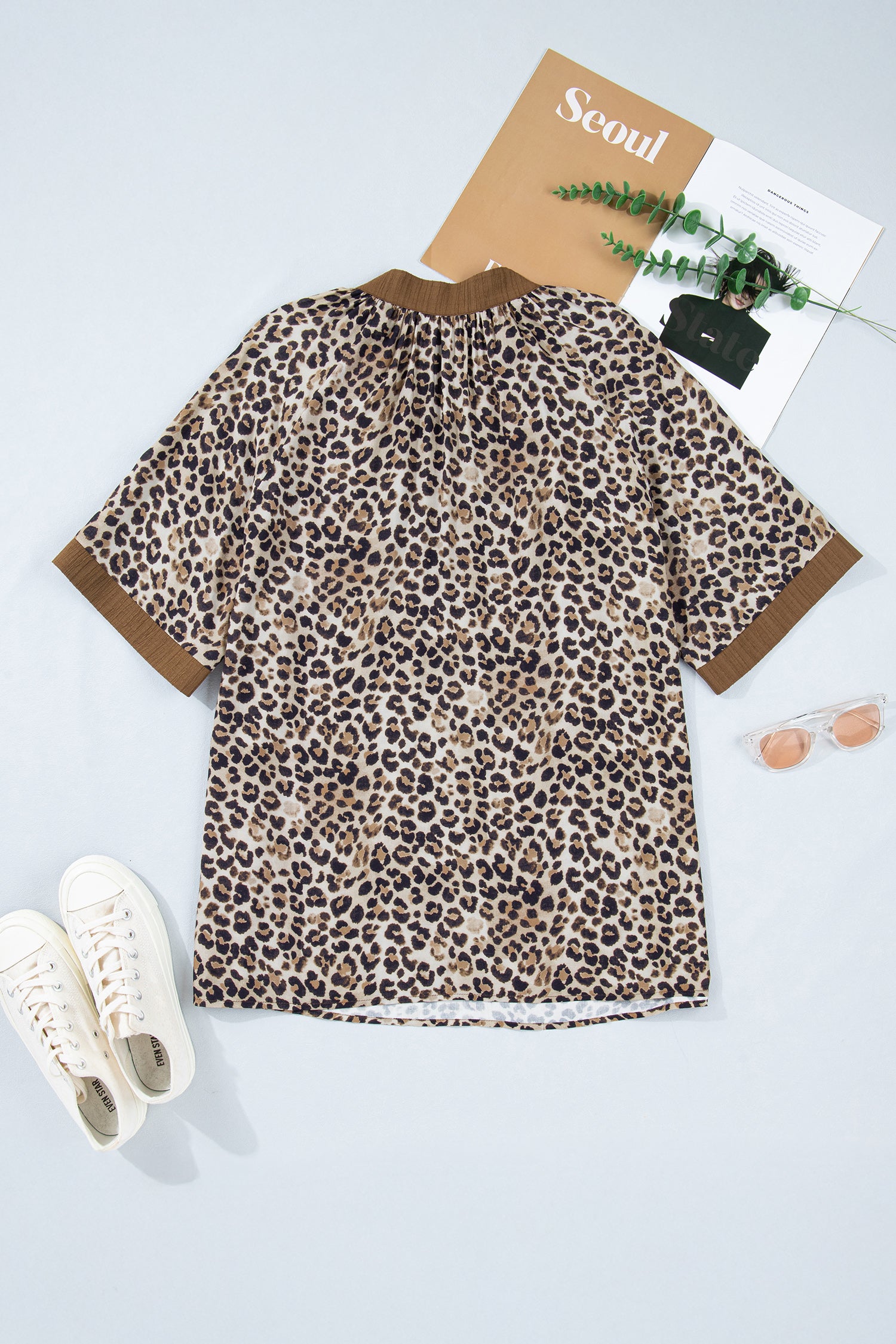 Brown plus size leopard print blouse with crinkled texture, colorblock patchwork, and V-neck from Lavendar Lane Clothing.