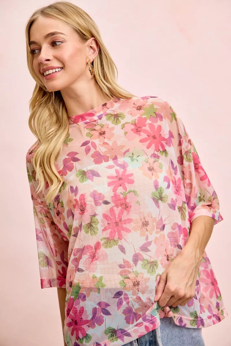 Floral print short sleeve mesh blouse by Lavendar Lane Clothing featuring a boxy fit and lightweight sheer fabric.