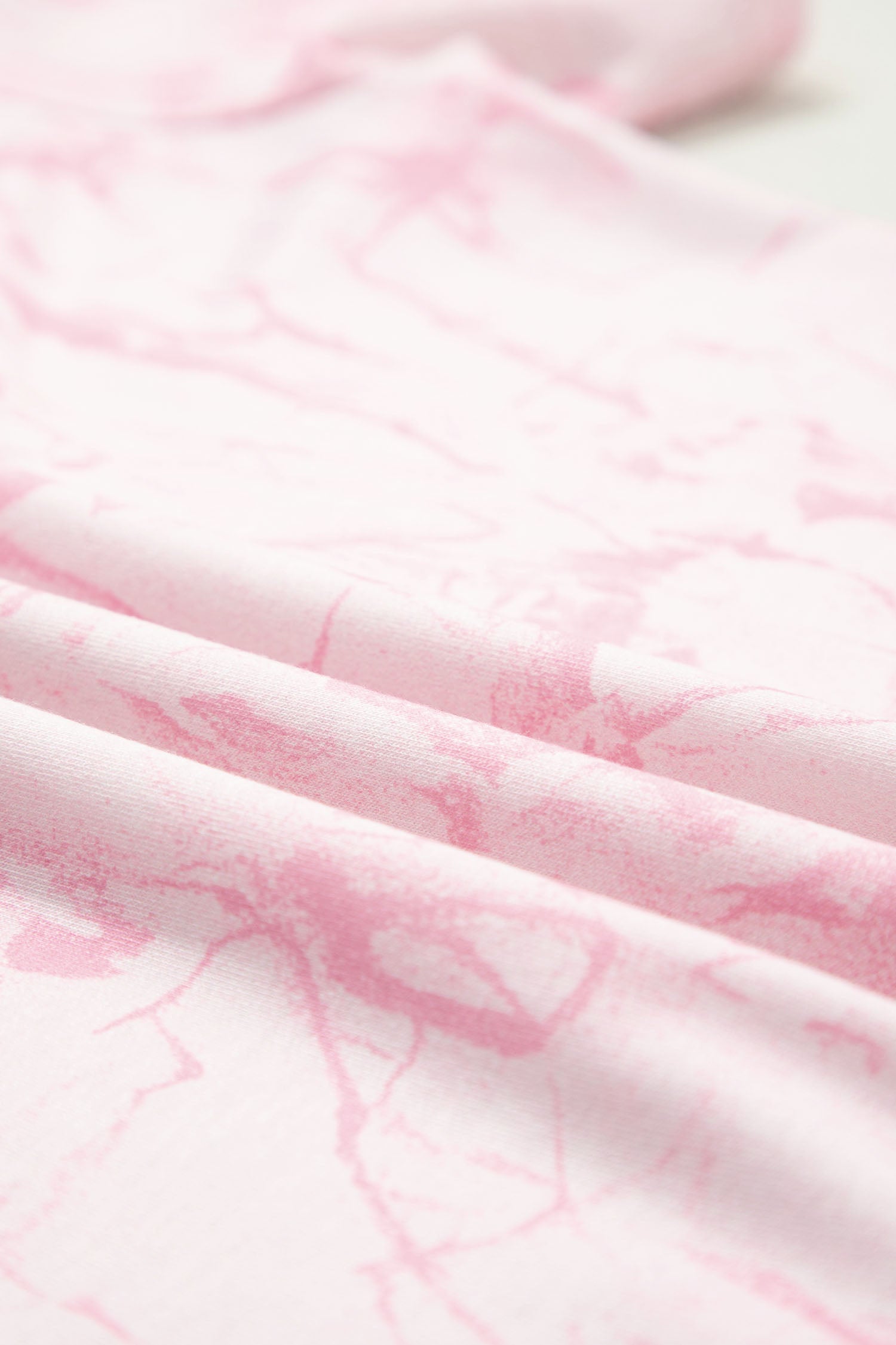 Pink abstract print V-neck loose tee with drawstring shorts, two-piece set from Lavendar Lane Clothing, casual summer outfit.