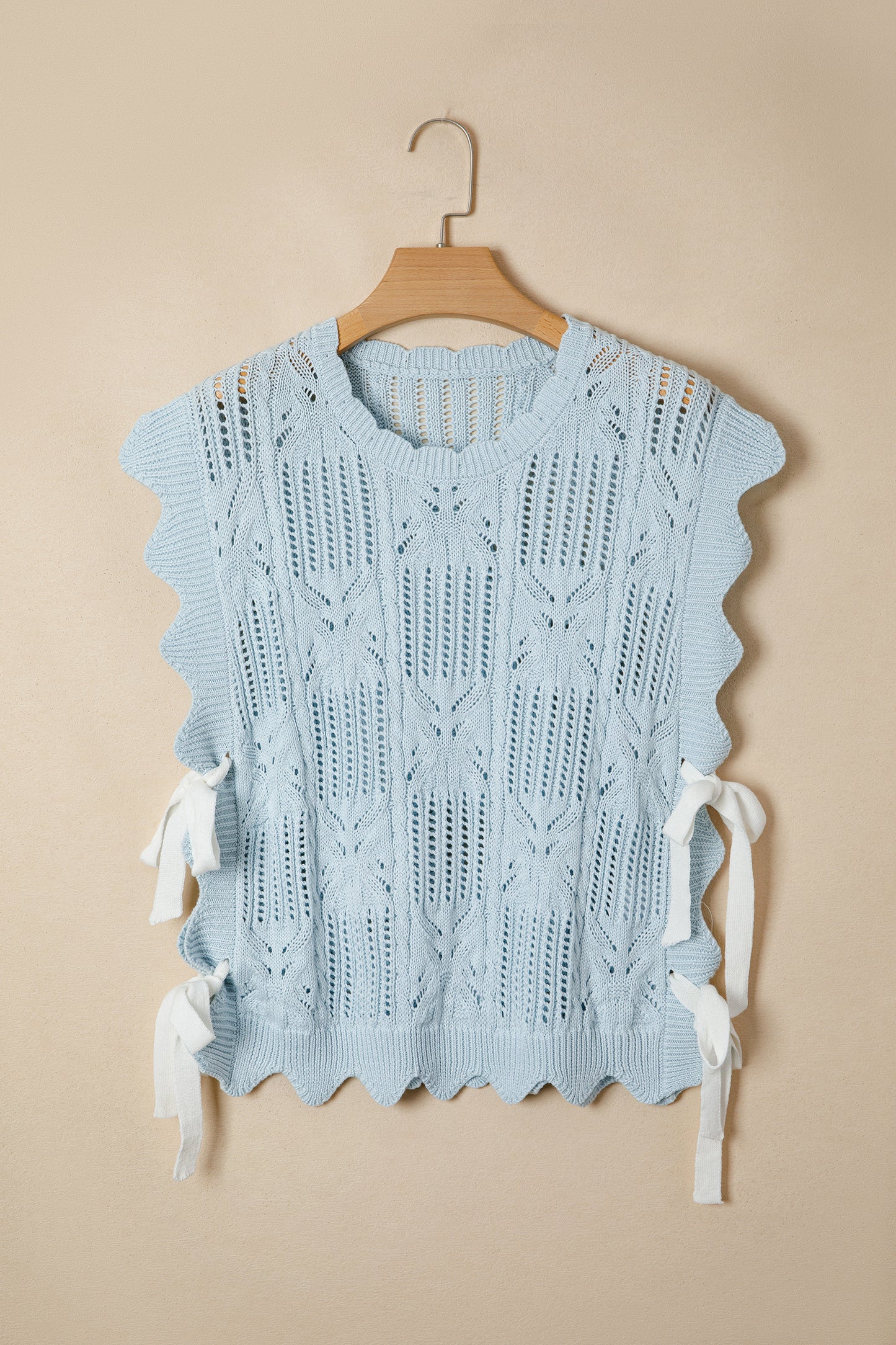 Lavendar Lane Blue Pointelle knit short sleeve sweater with scalloped trim, featuring a patterned design and lightweight fabric.