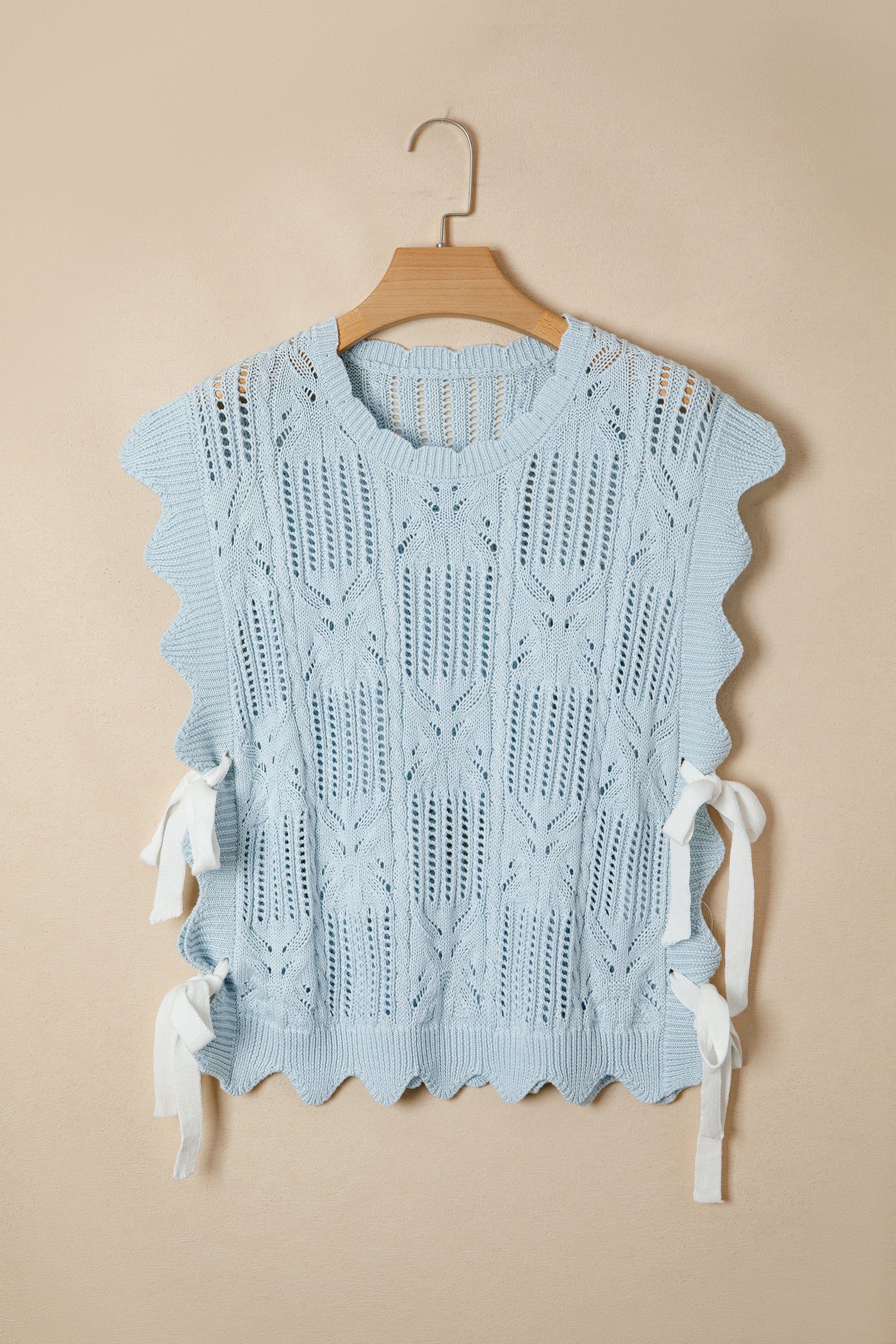 Lavendar Lane Blue Pointelle knit short sleeve sweater with scalloped trim, featuring a patterned design and lightweight fabric.