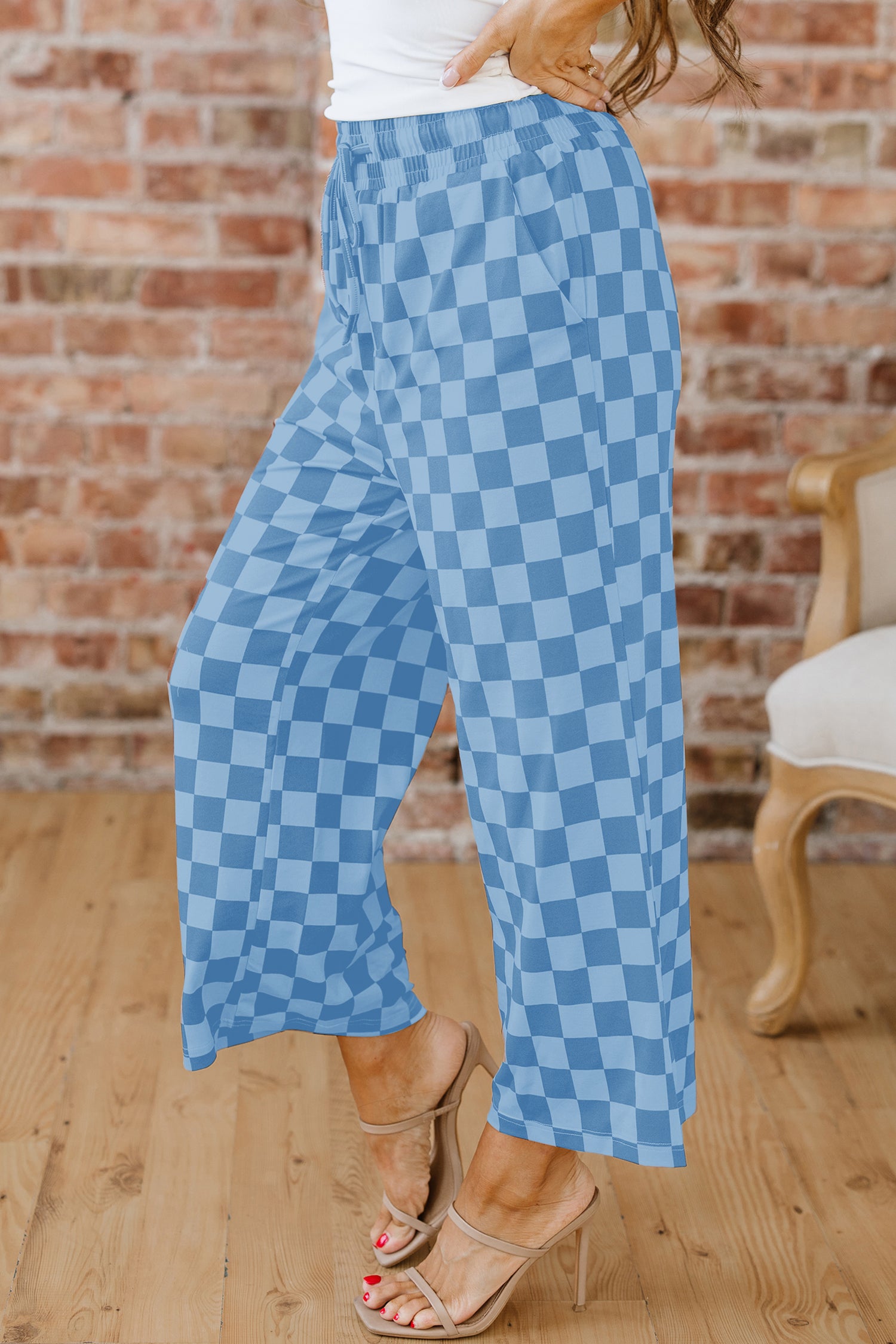 Sky blue checkered elastic high-waist casual pants from Lavendar Lane Clothing, featuring a loose fit and comfortable design.