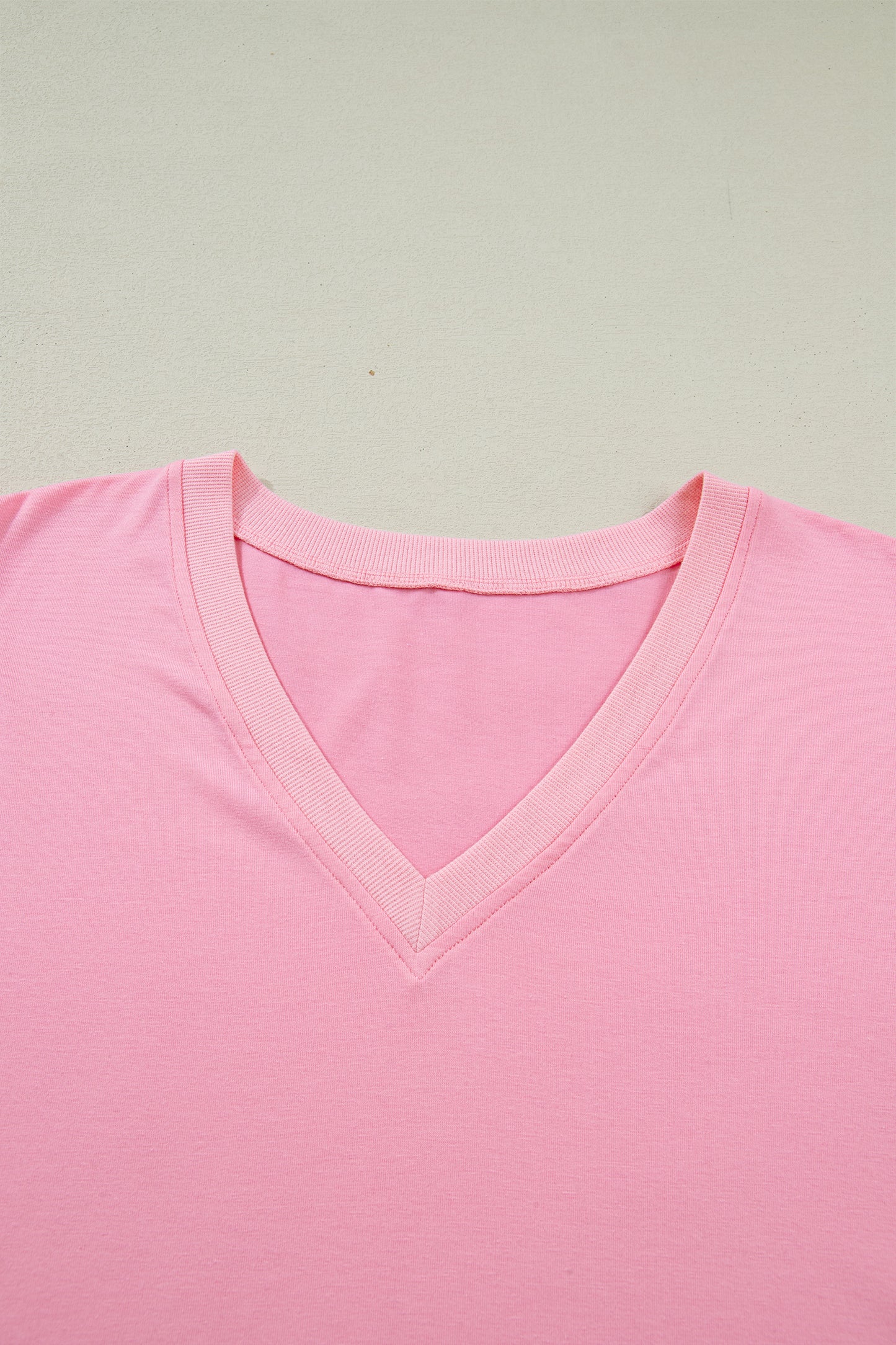 Lavendar Lane plus size blouse with V-neck, pleated front, short puff sleeves, and a relaxed fit.