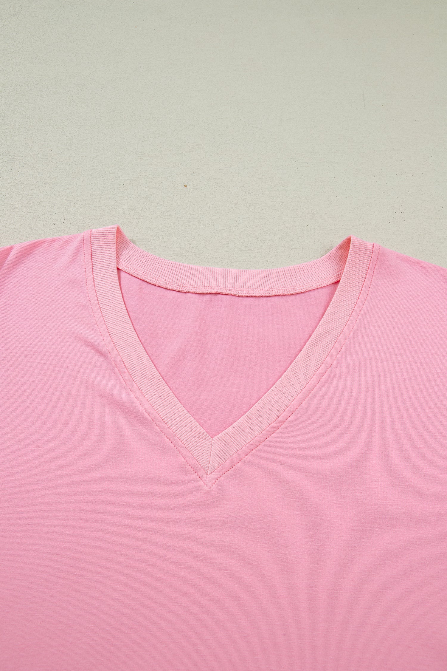 Lavendar Lane plus size blouse with V-neck, pleated front, short puff sleeves, and a relaxed fit.