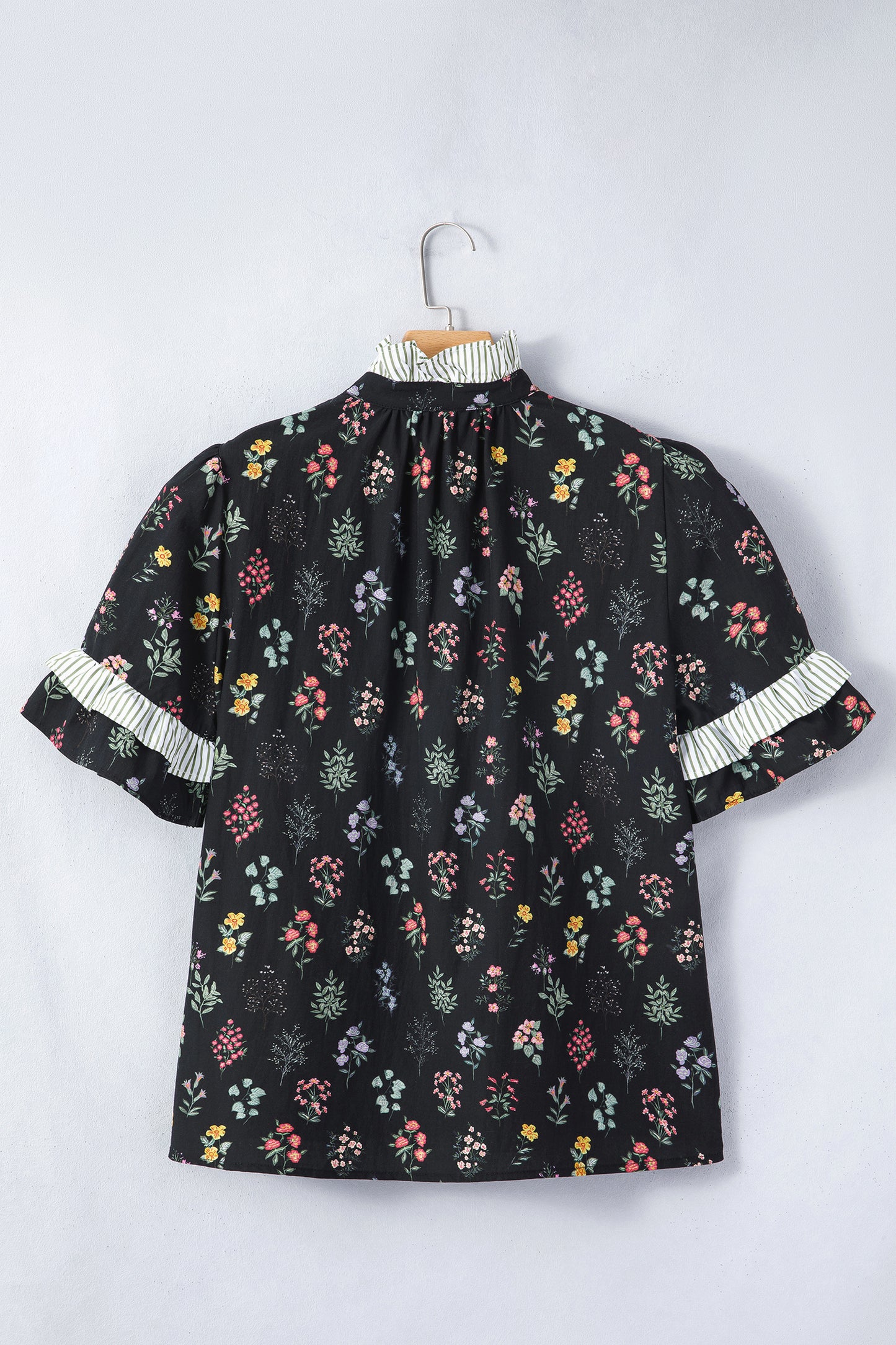 Black floral short sleeve blouse with frilled trim from Lavendar Lane Clothing, featuring contrast details and a feminine design.