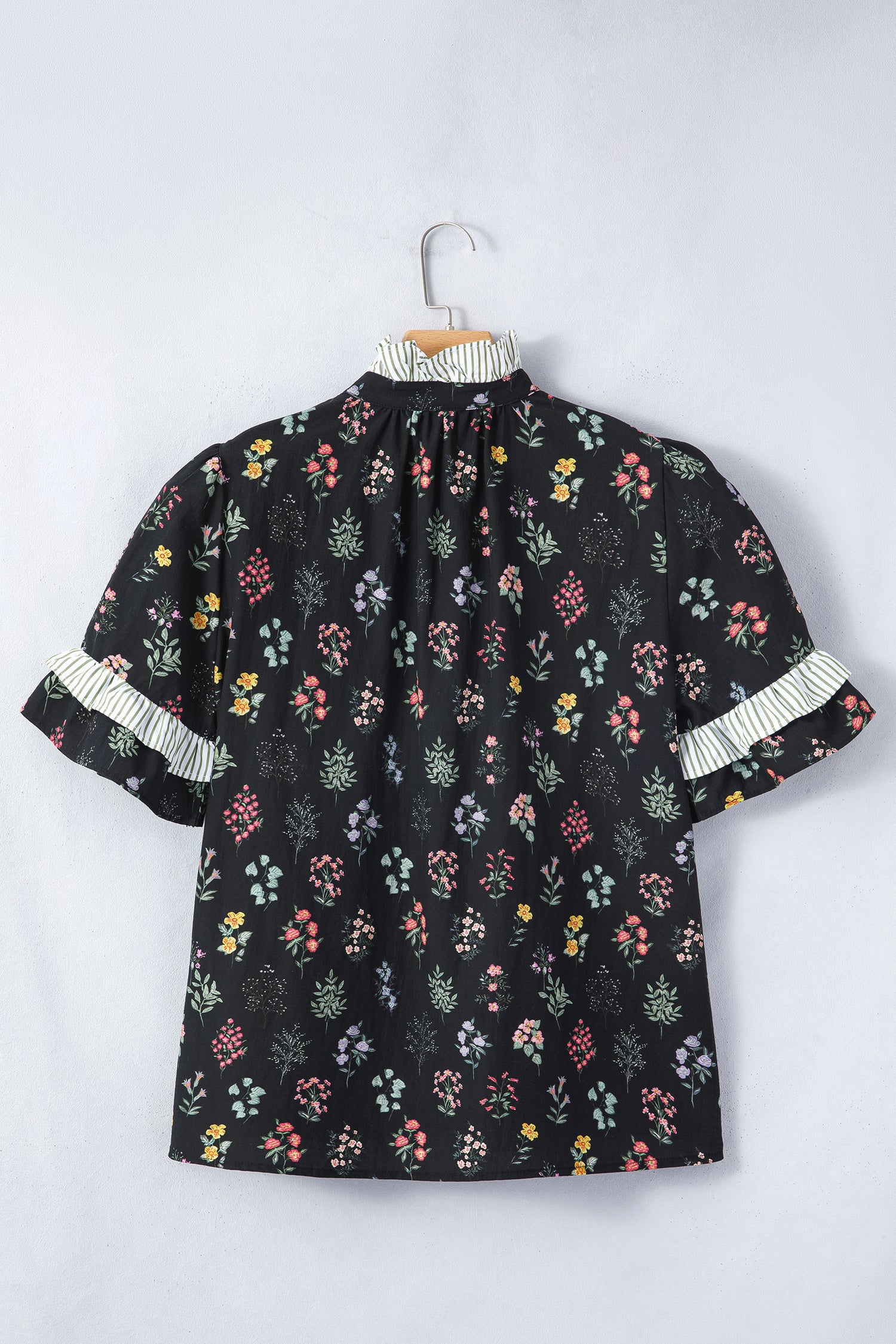 Black floral short sleeve blouse with frilled trim from Lavendar Lane Clothing, featuring contrast details and a feminine design.