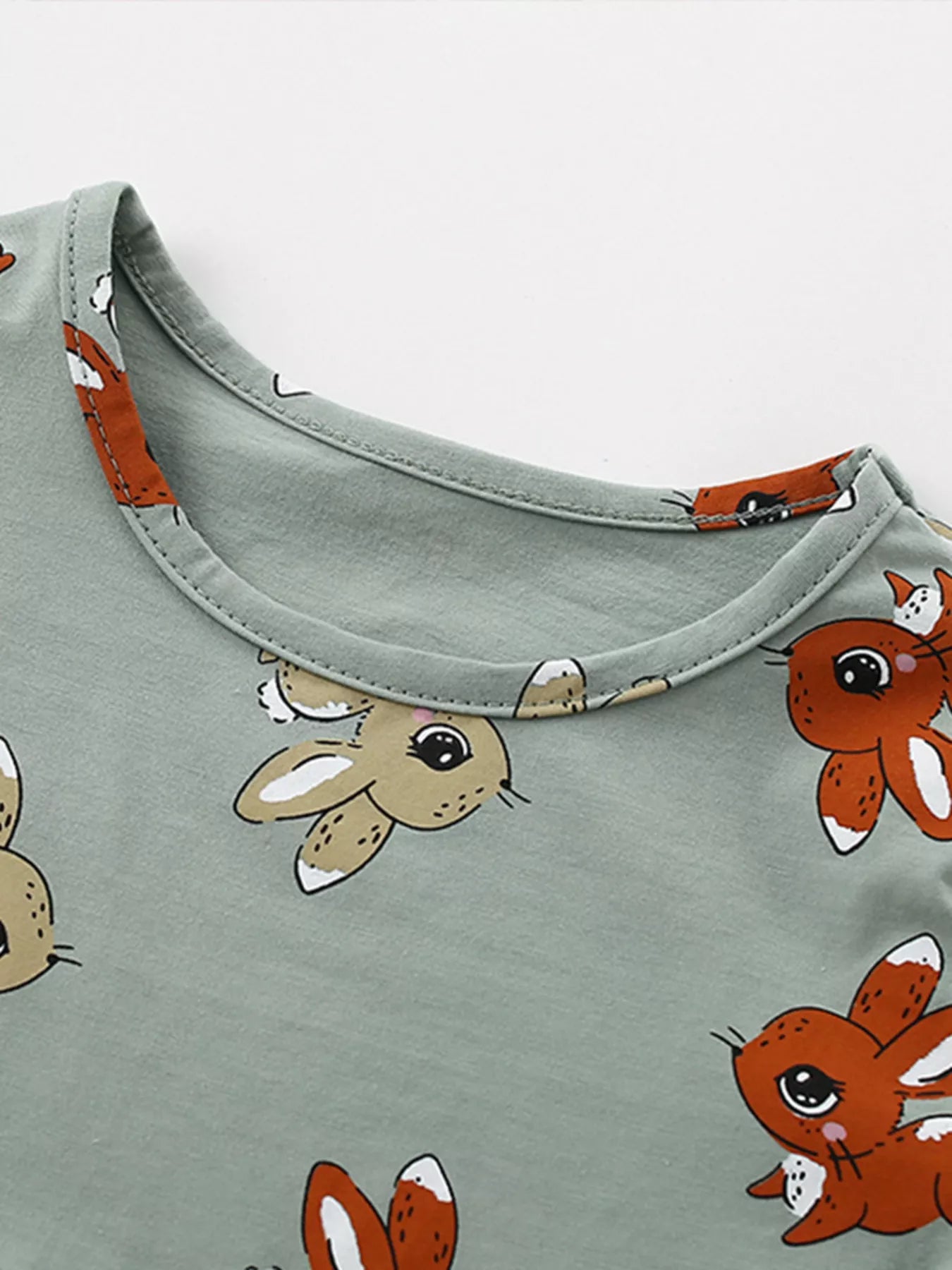 Children's lavender tiered dress with cute cartoon print from Lavender Lane Clothing, featuring a playful, colorful design.