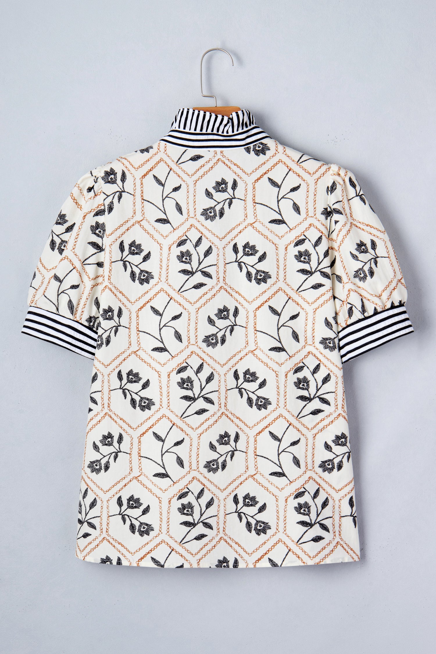 White floral print striped patchwork blouse with button neck and short sleeves by Lavender Lane Clothing.