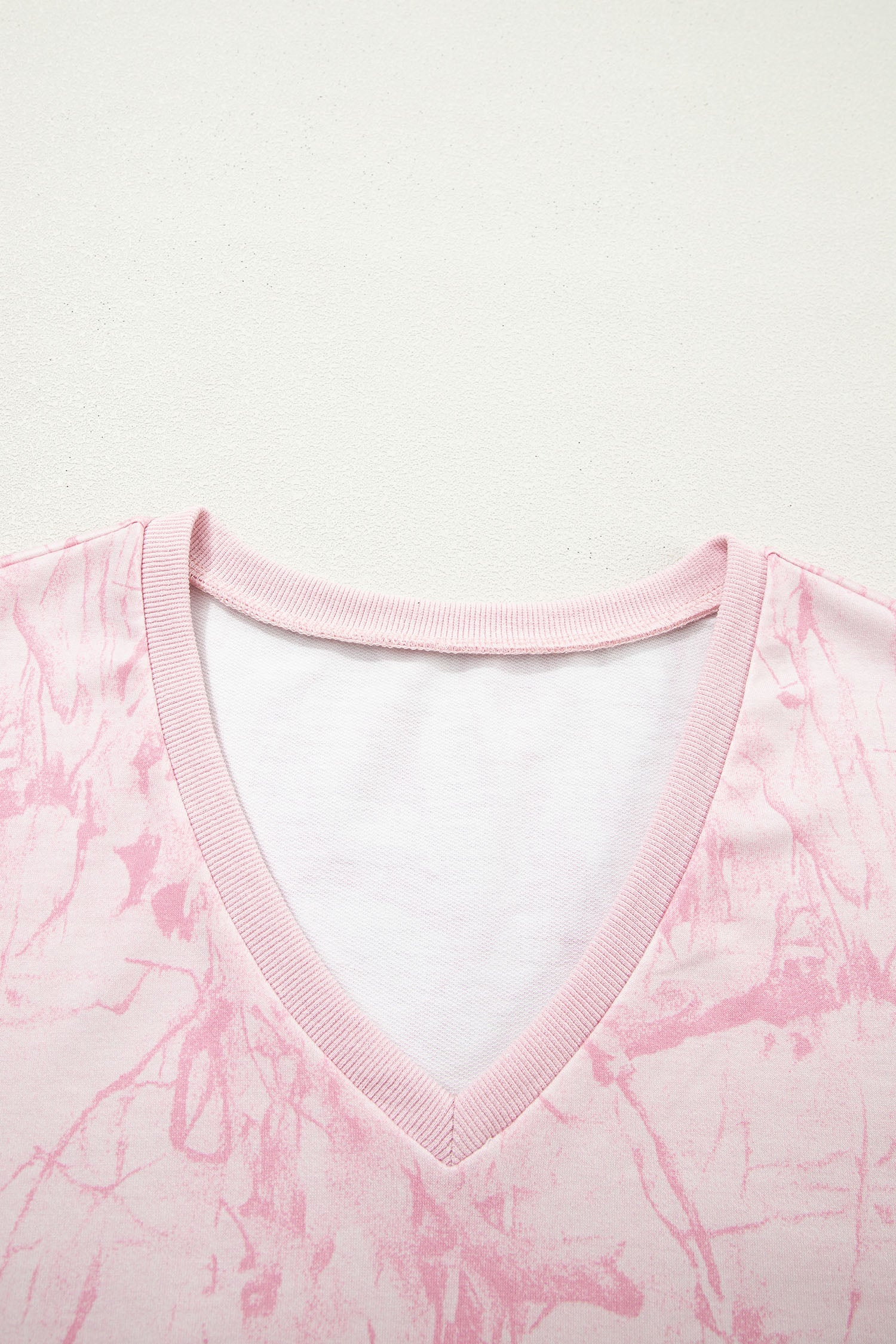 Pink abstract print V-neck loose tee and drawstring shorts two-piece set by Lavendar Lane Clothing, casual summer outfit.