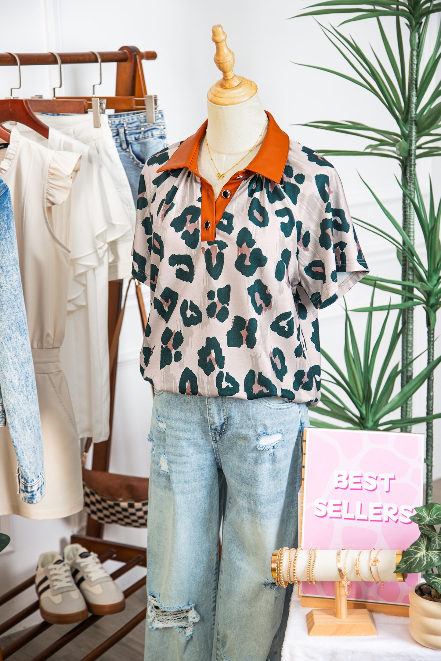 Lavendar Lane Clothing leopard print short sleeve blouse with contrast collar, casual and unique design, perfect for stylish everyday wear.