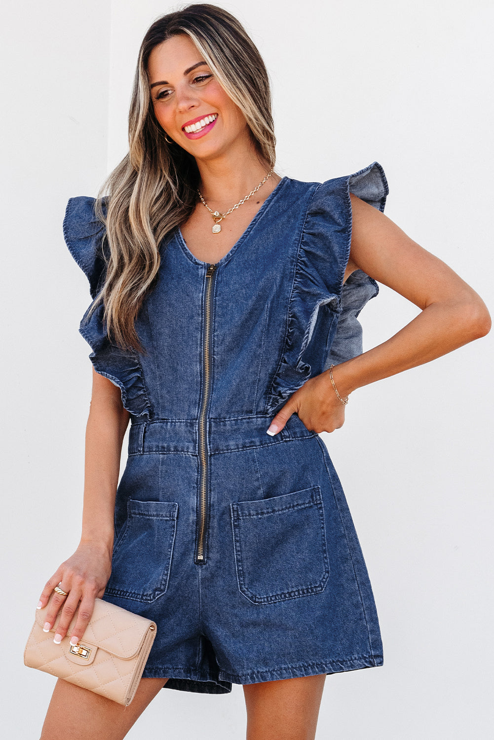 Lavendar Lane Clothing Sail Blue denim romper with ruffled front zipper and belt, perfect for casual wear.