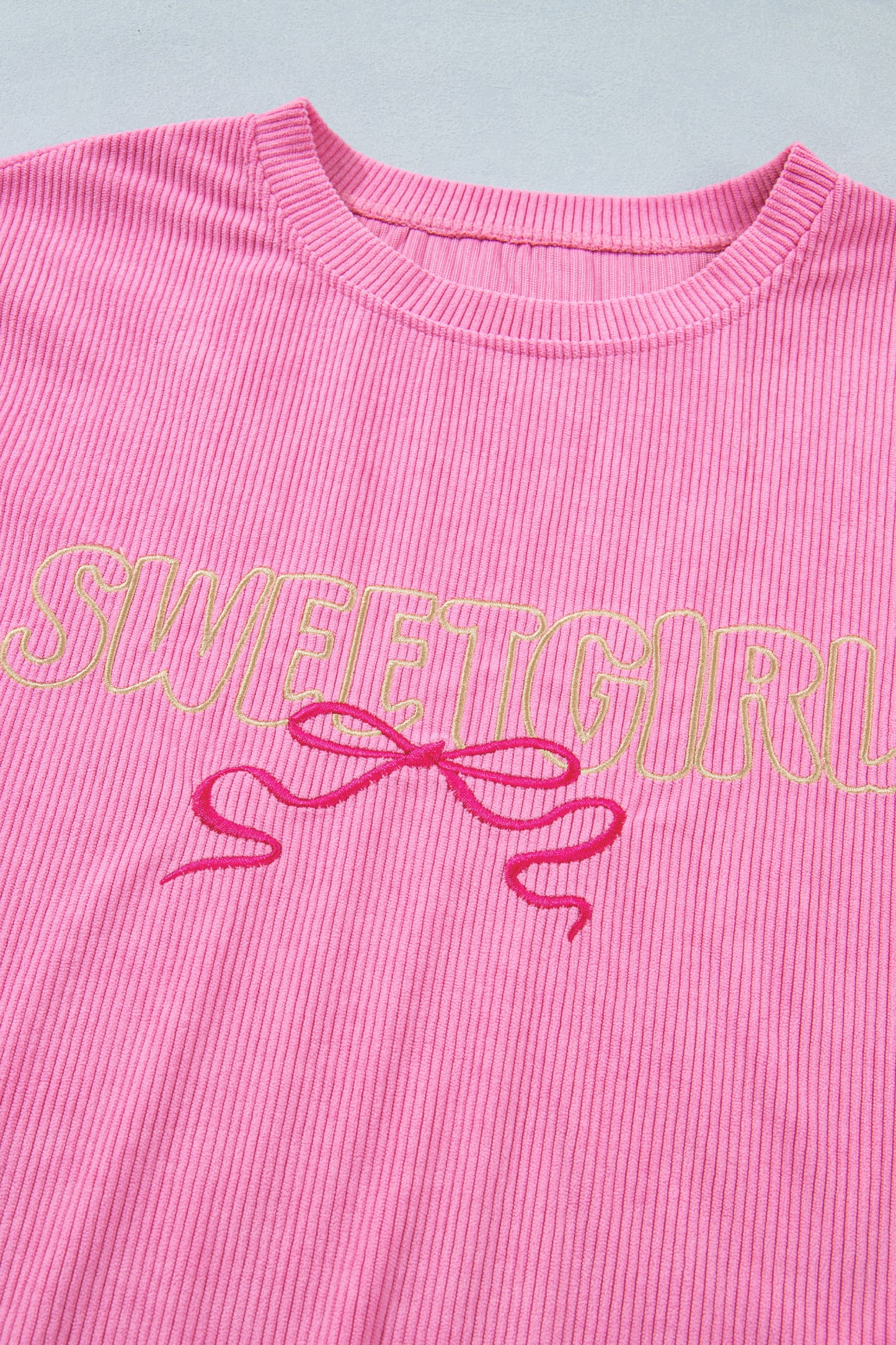Lavendar Lane Clothing Bonbon Sweet Girl top featuring embroidered graphic on rib textured fabric in soft pastel colors.