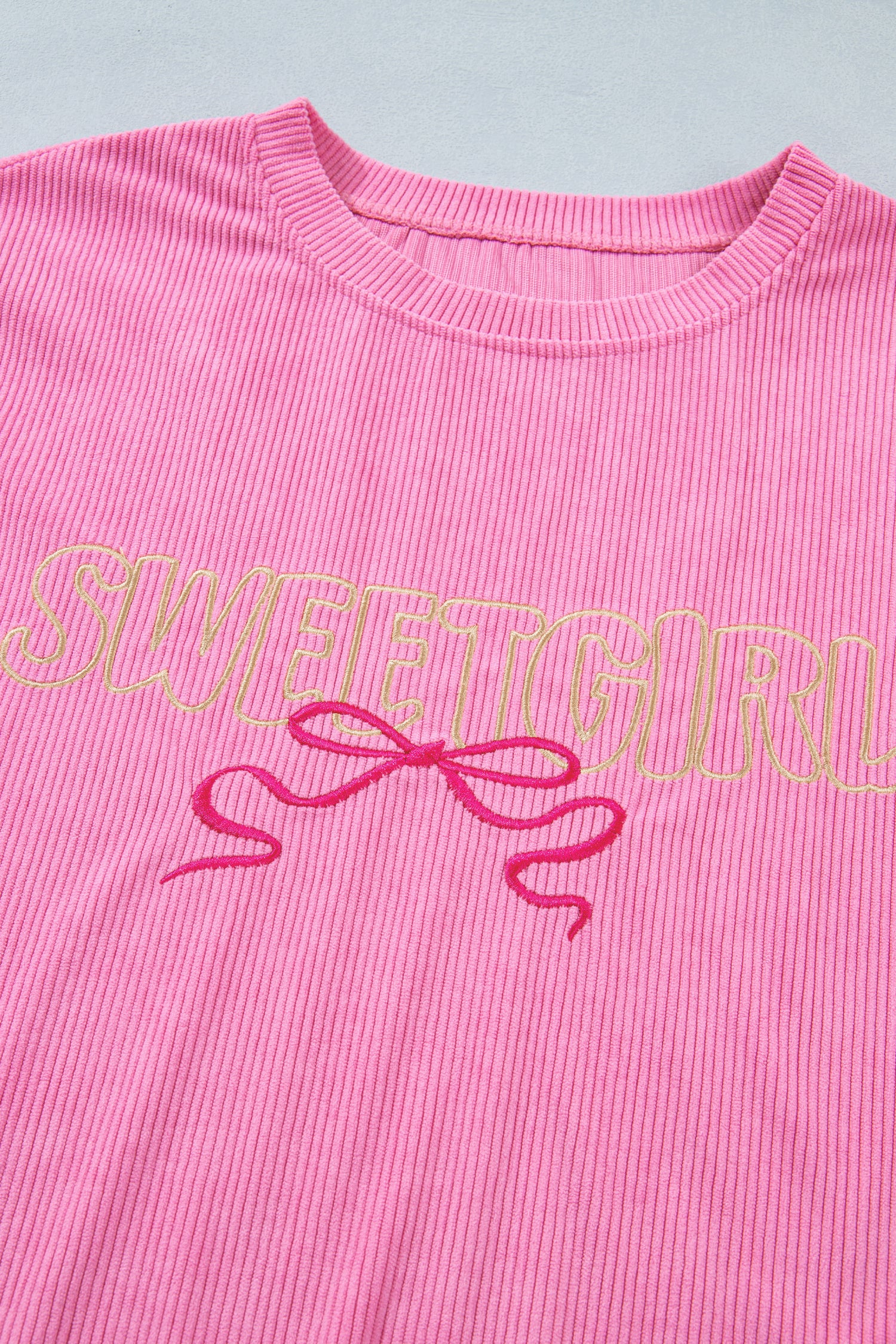 Lavendar Lane Clothing Bonbon Sweet Girl top featuring embroidered graphic on rib textured fabric in soft pastel colors.