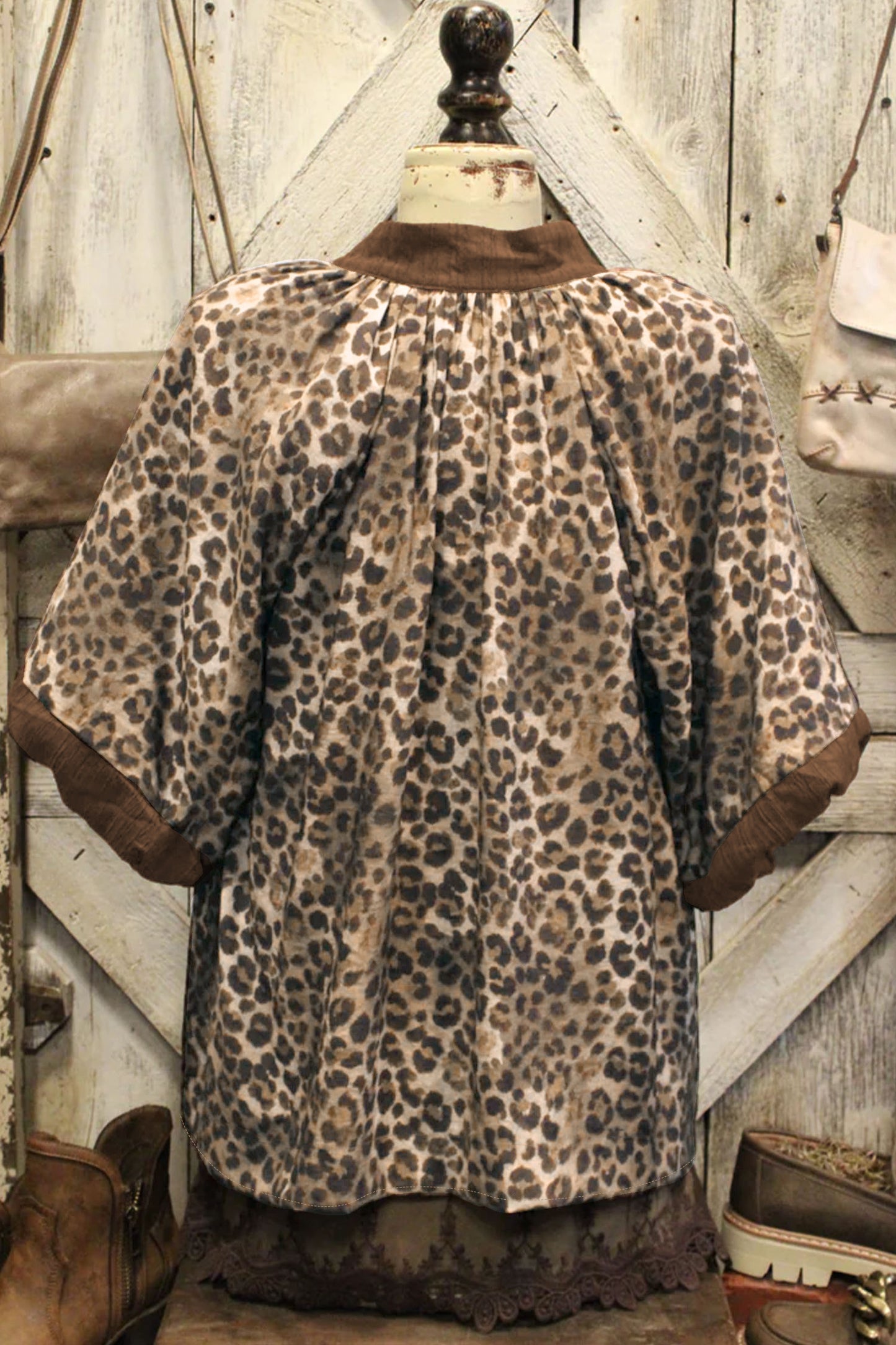Brown plus size leopard print crinkled colorblock V-neck blouse from Lavendar Lane Clothing, featuring patchwork design and relaxed fit.