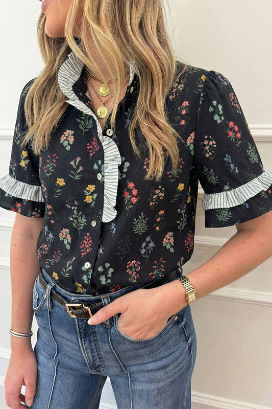 Black floral blouse with contrast frilled trim short sleeves from Lavendar Lane Clothing, showcasing a stylish, feminine top.