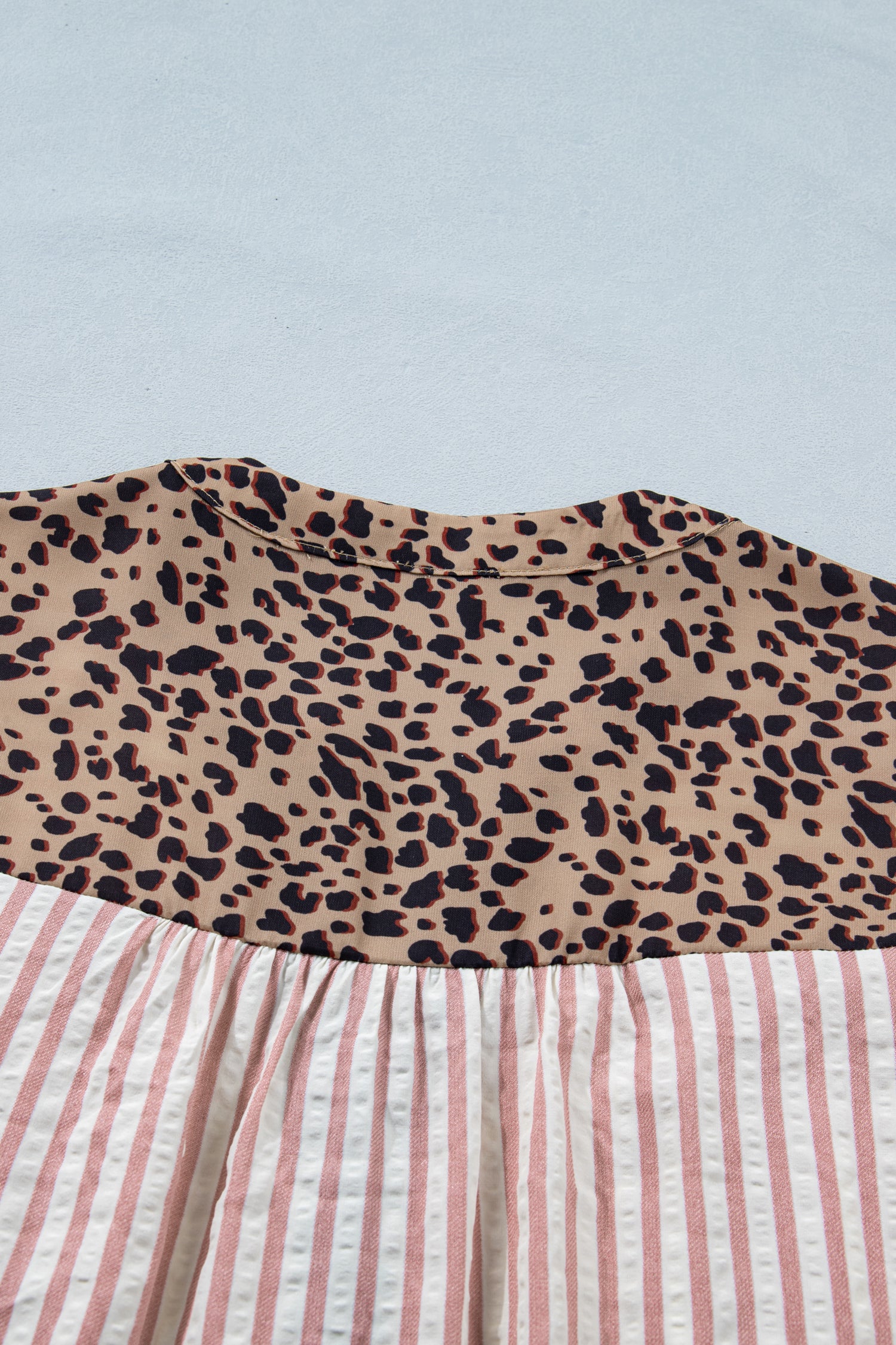 Pink stripe leopard trim V-neck button-down top by Lavender Lane Clothing, featuring half sleeves and stylish design.