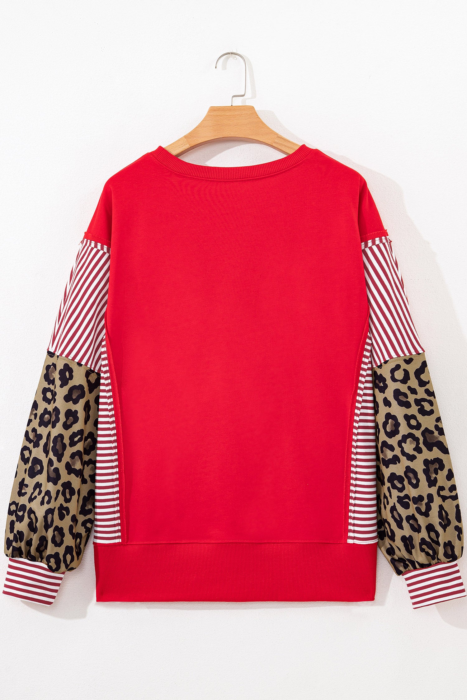 Racing red striped patchwork sleeve colorblock top by Lavendar Lane Clothing, featuring vibrant red, striped pattern, and colorblock design.
