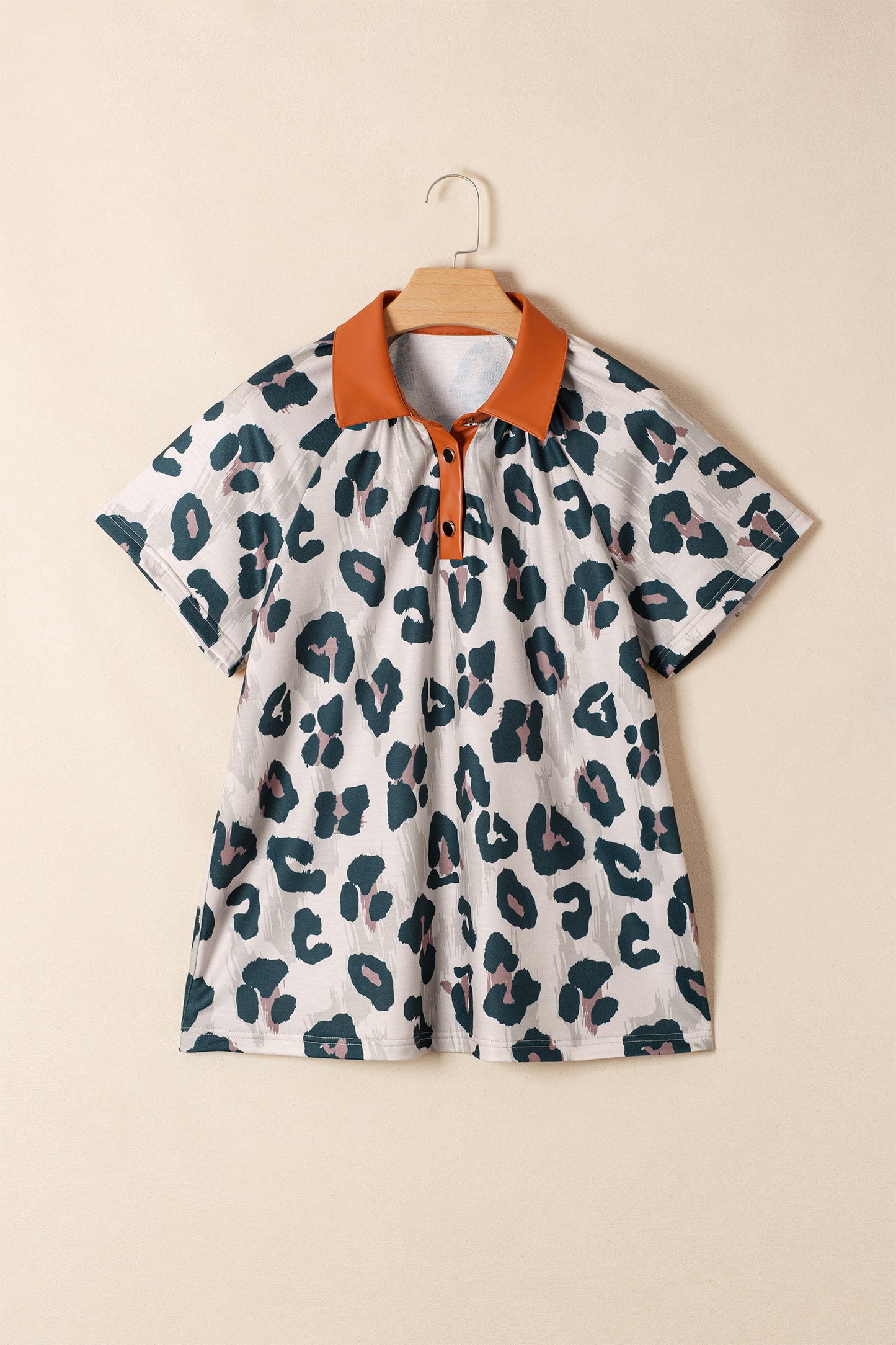 Lavendar Lane Clothing leopard print short sleeve blouse with contrast collar and button details, casual and stylish women's top.