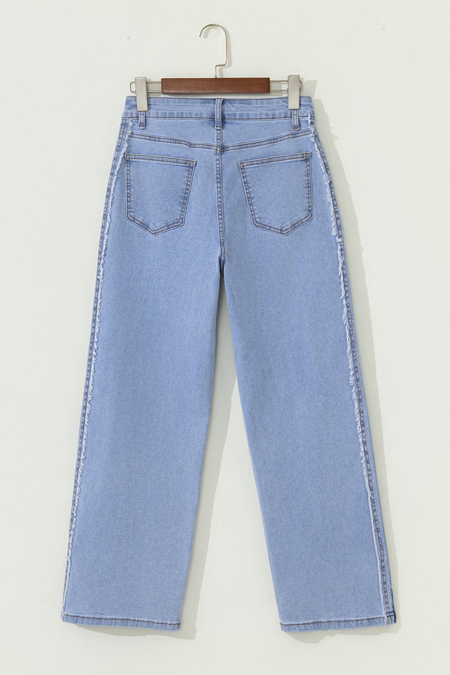 Lavendar Lane Clothing Beau Blue contrast stripe frayed side panel patchwork shift jeans, showing the stylish denim with unique details.